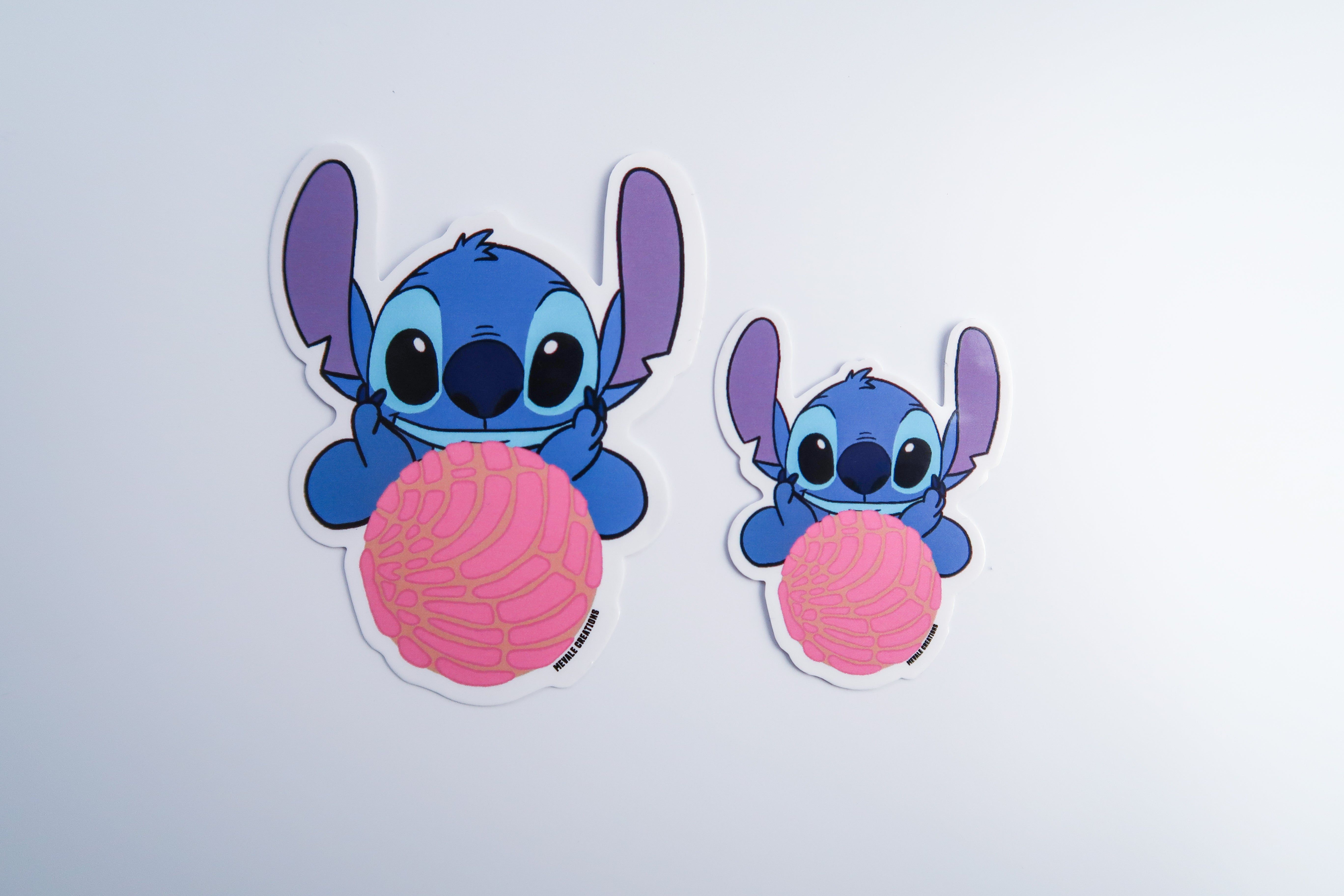 A sticker of two blue and pink characters - Stitch, sticker
