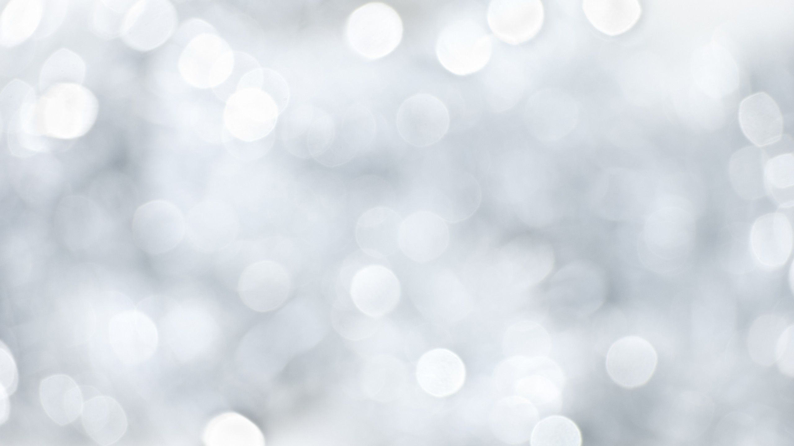 A white and silver bokeh background - 2560x1440