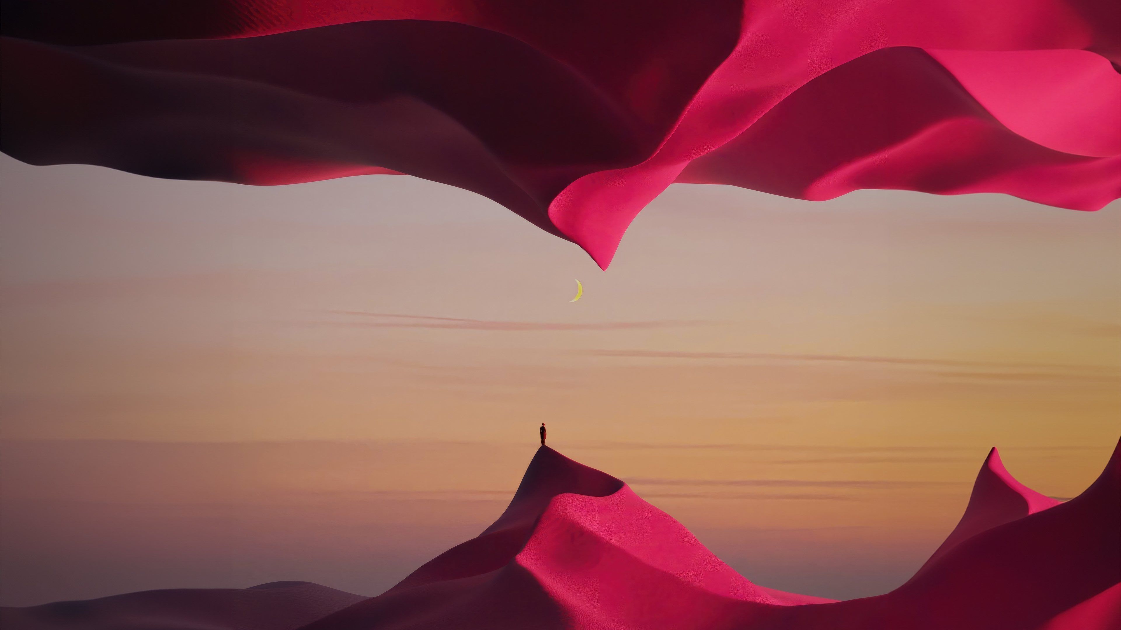 Pink fabric swaying in the wind with a person standing on a hill in the distance - Desert