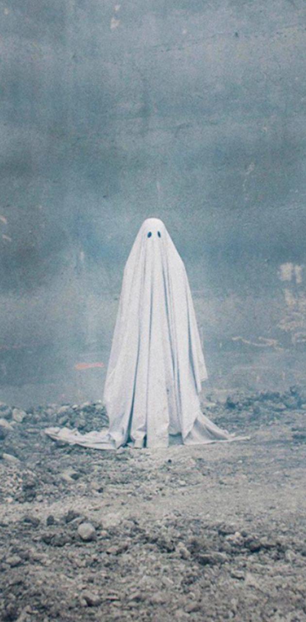 A ghost is standing in the middle of an empty field - Ghost