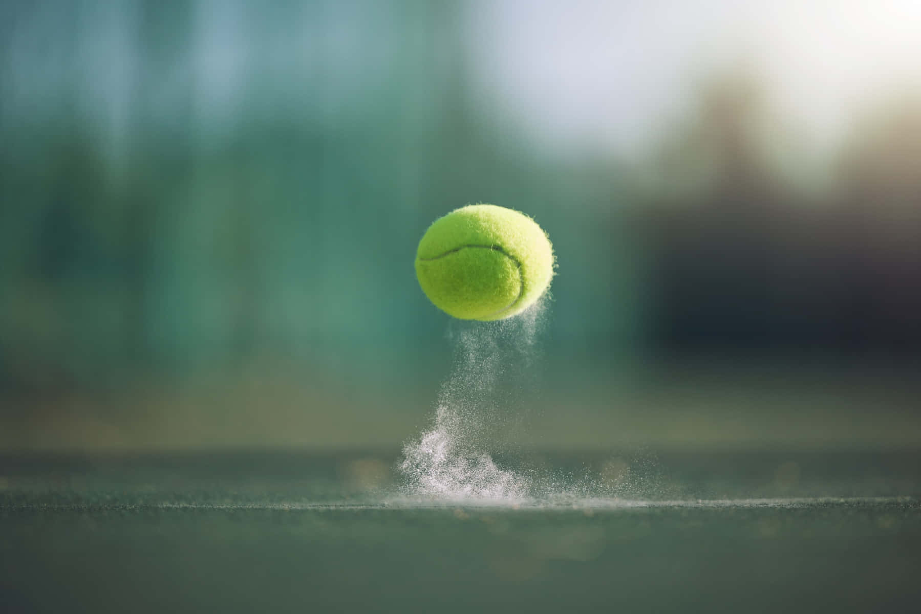 A tennis ball bouncing on a tennis court - Tennis