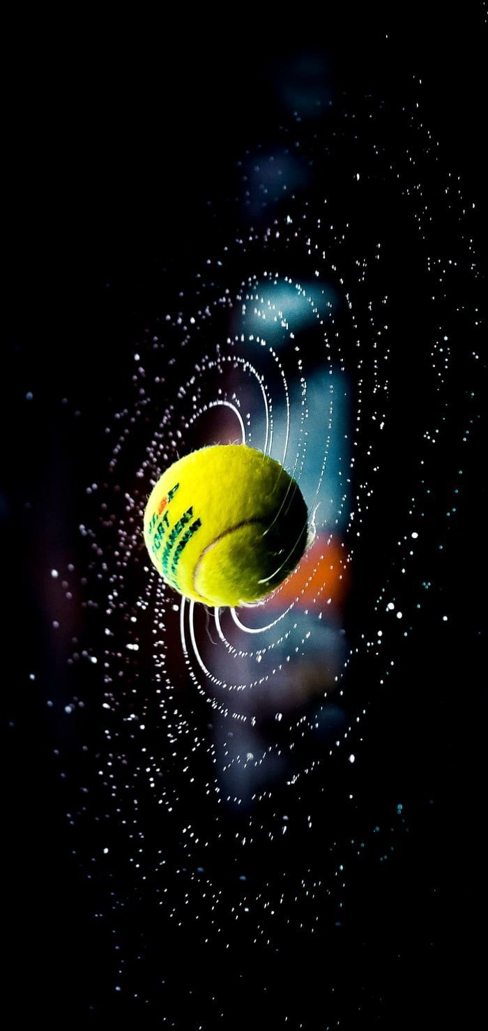 A tennis ball in space. - Tennis