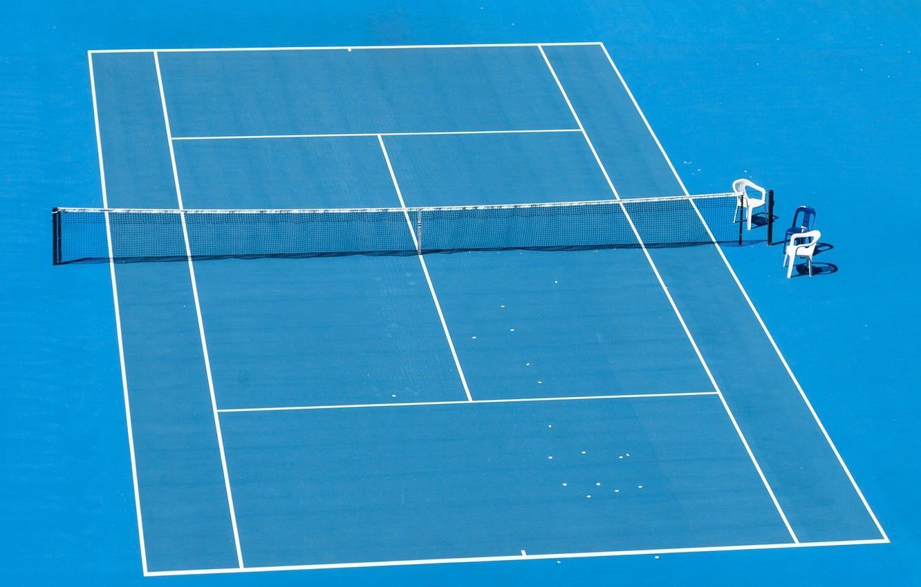 A tennis court with a net and two chairs - Tennis
