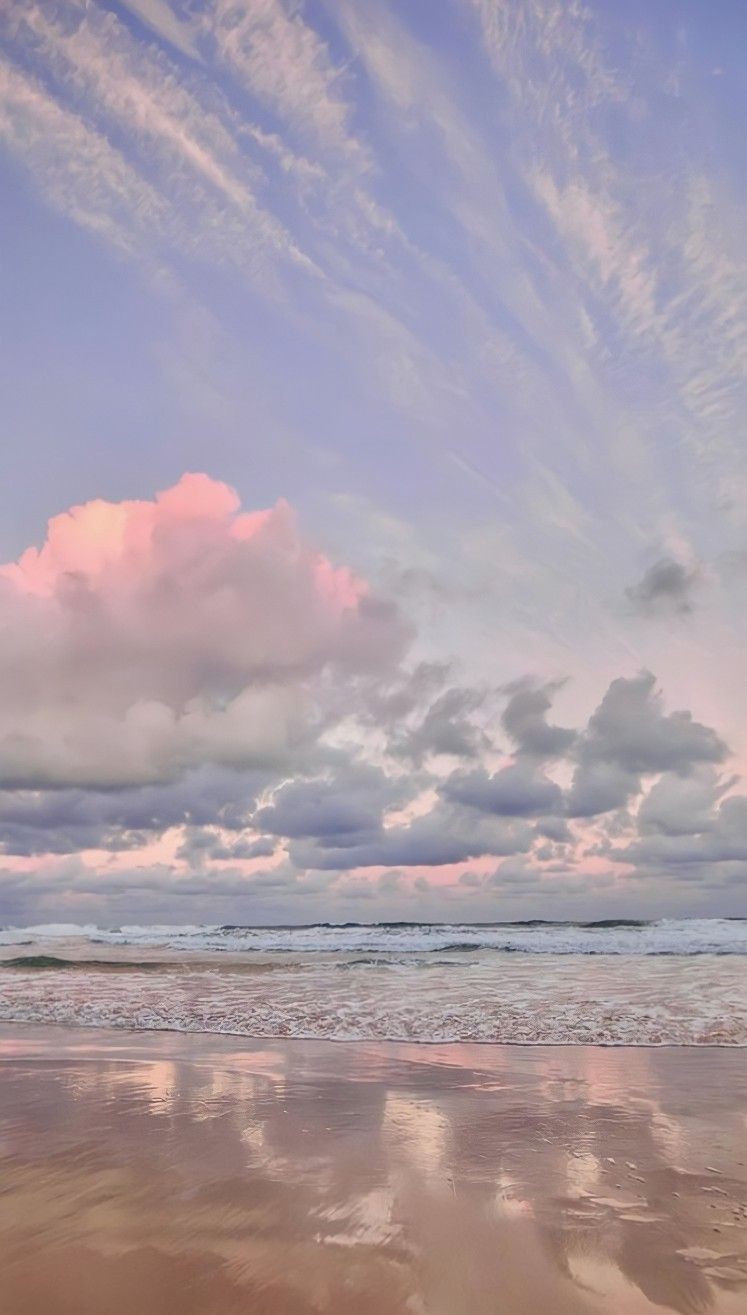 A beautiful landscape wallpaper of a beach with the sky reflecting in the water. - Florida