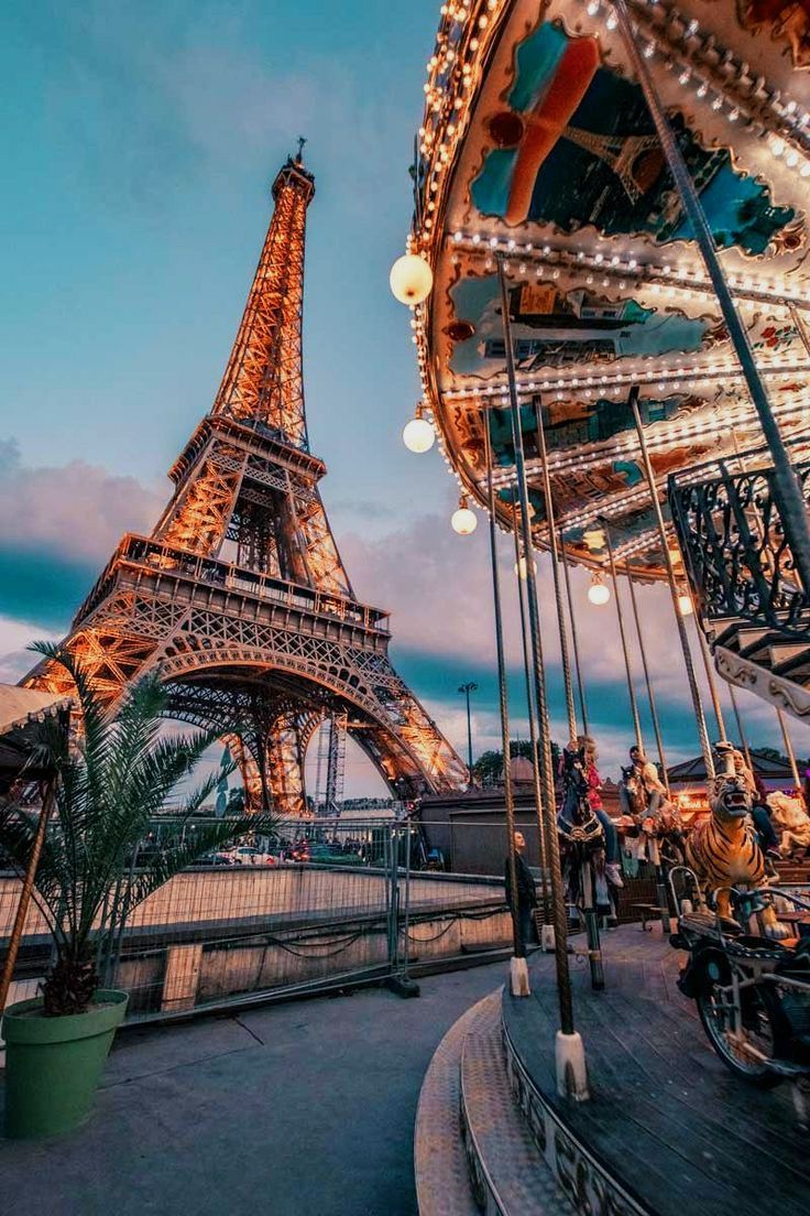 A carousel with the Eiffel Tower in the background - Eiffel Tower