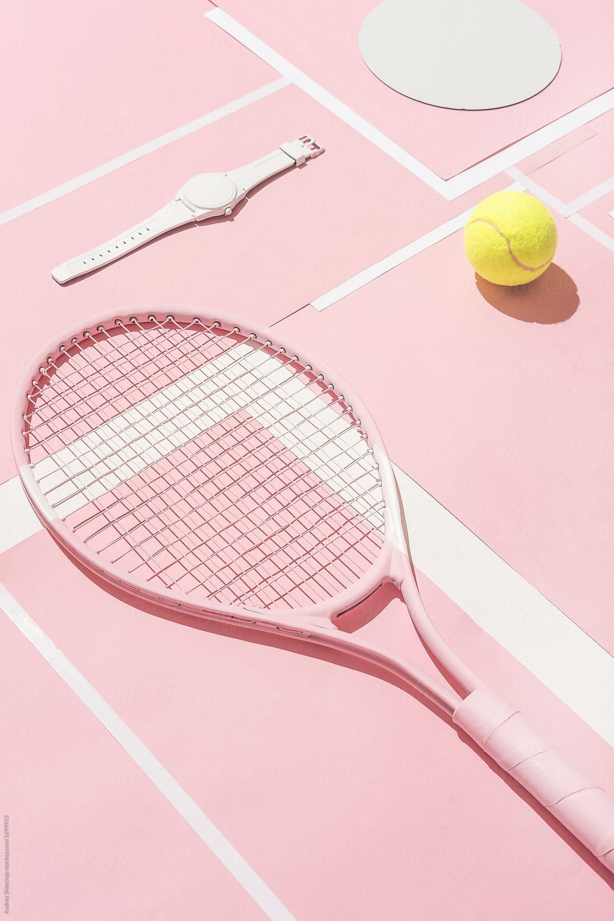 Tennis racket, ball and watch on a pink tennis court - Tennis
