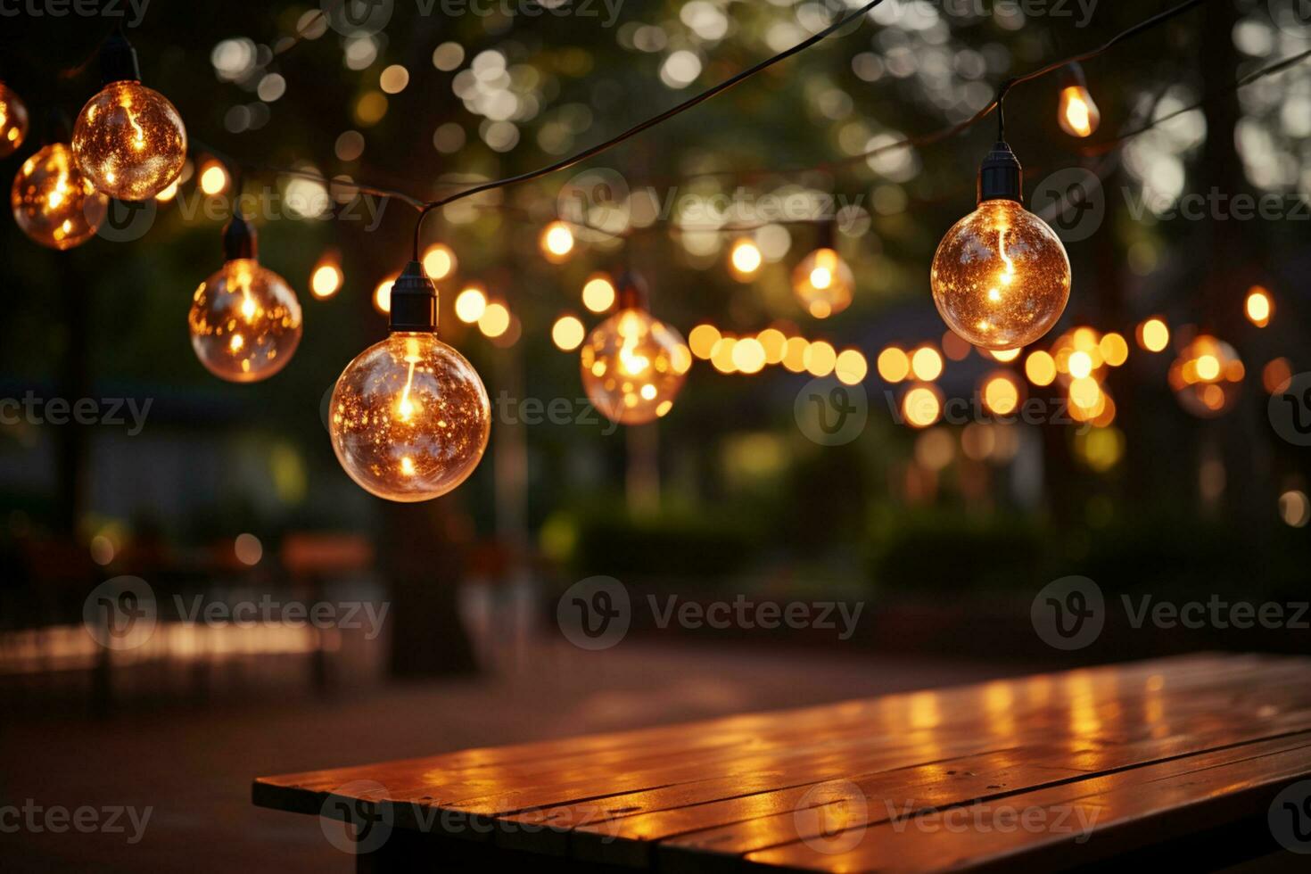 Festive outdoor string lights adorn a garden with blurred silhouettes