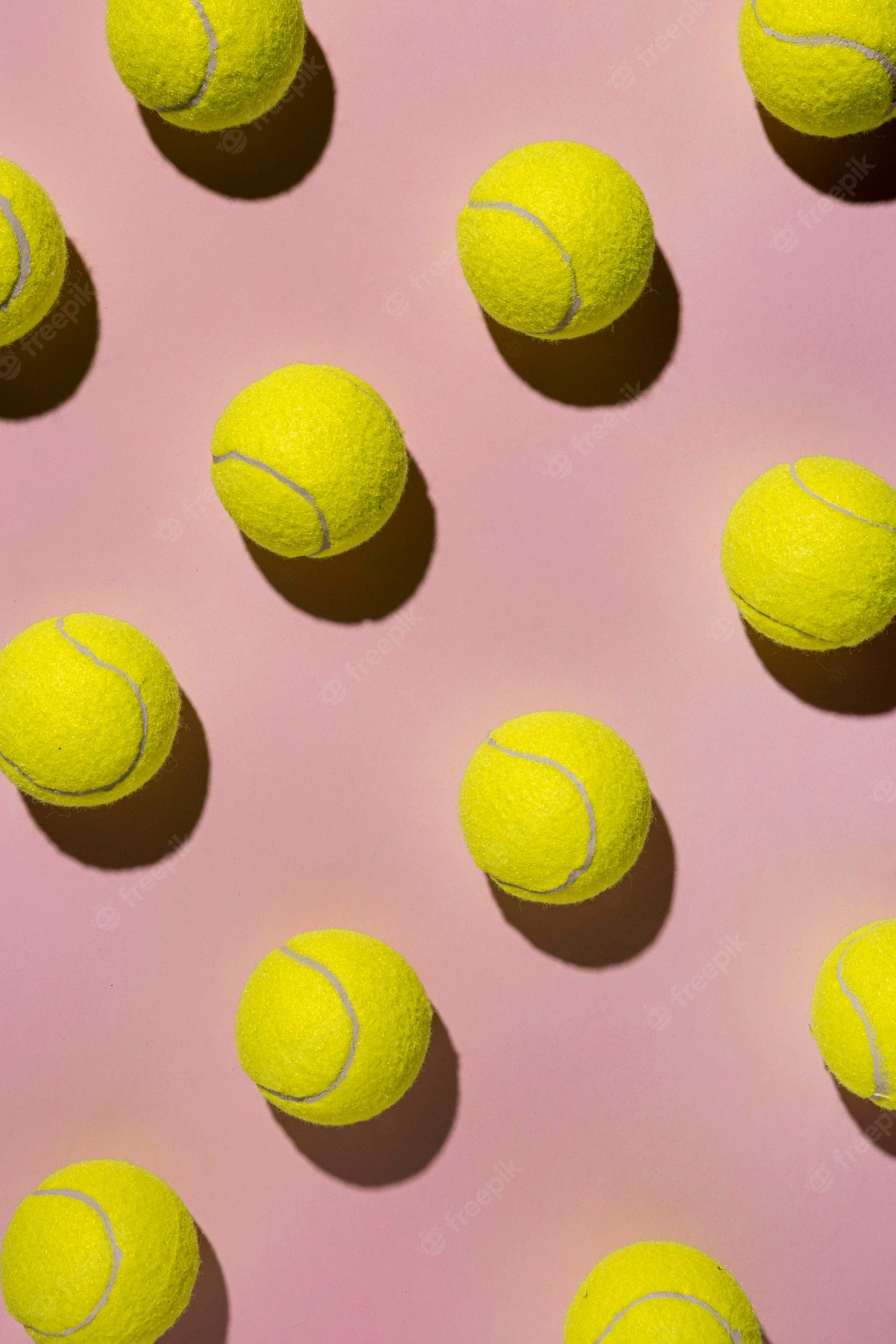 A bunch of tennis balls on pink background - Tennis