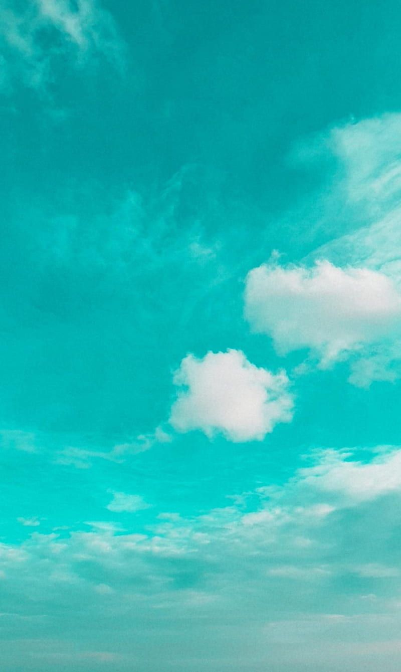 A photo of a blue sky with white clouds - Turquoise