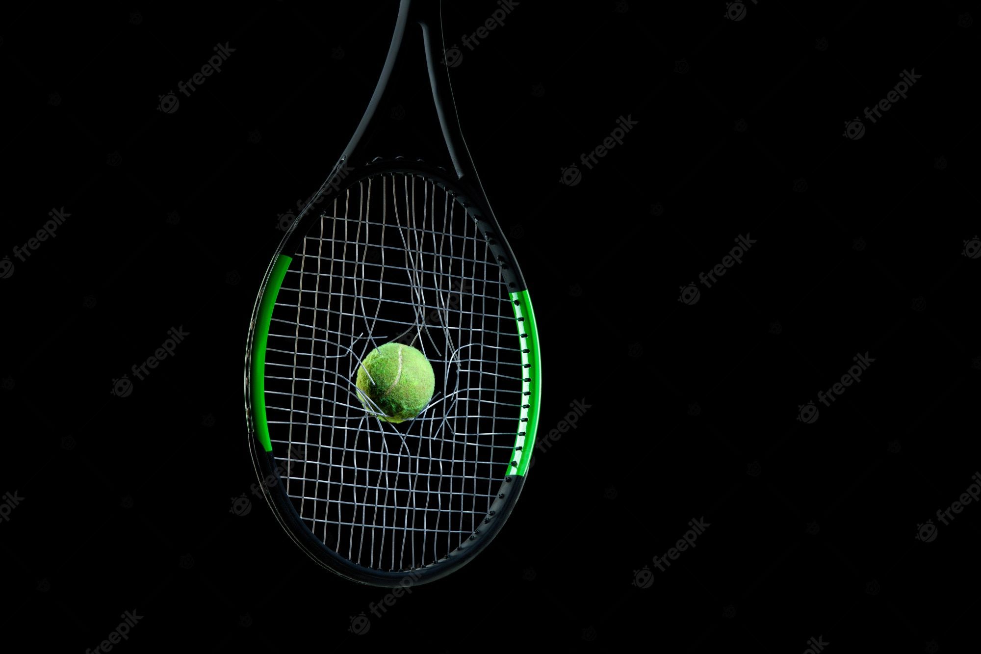 Tennis racket with a ball on the black background - Tennis