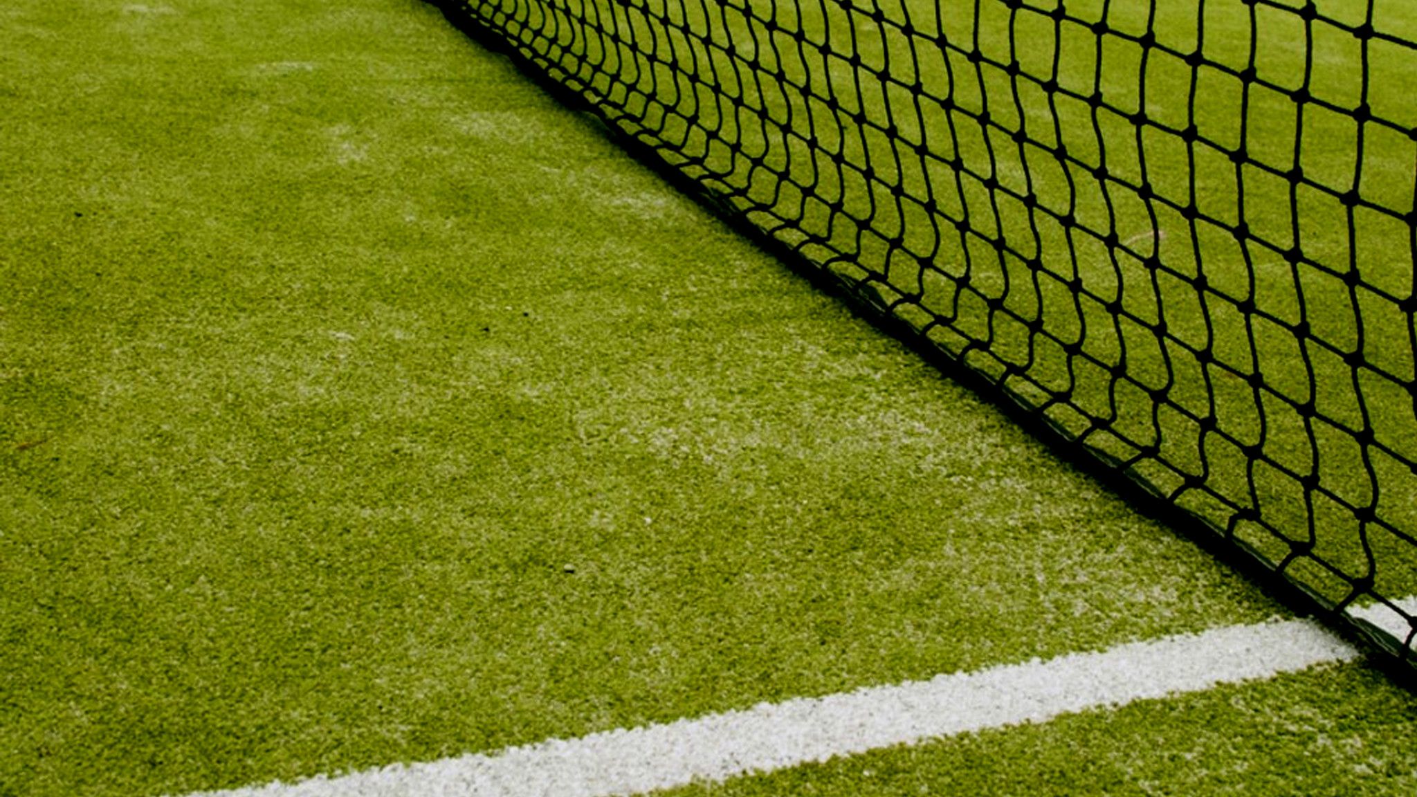 A tennis player is standing on the court - Tennis