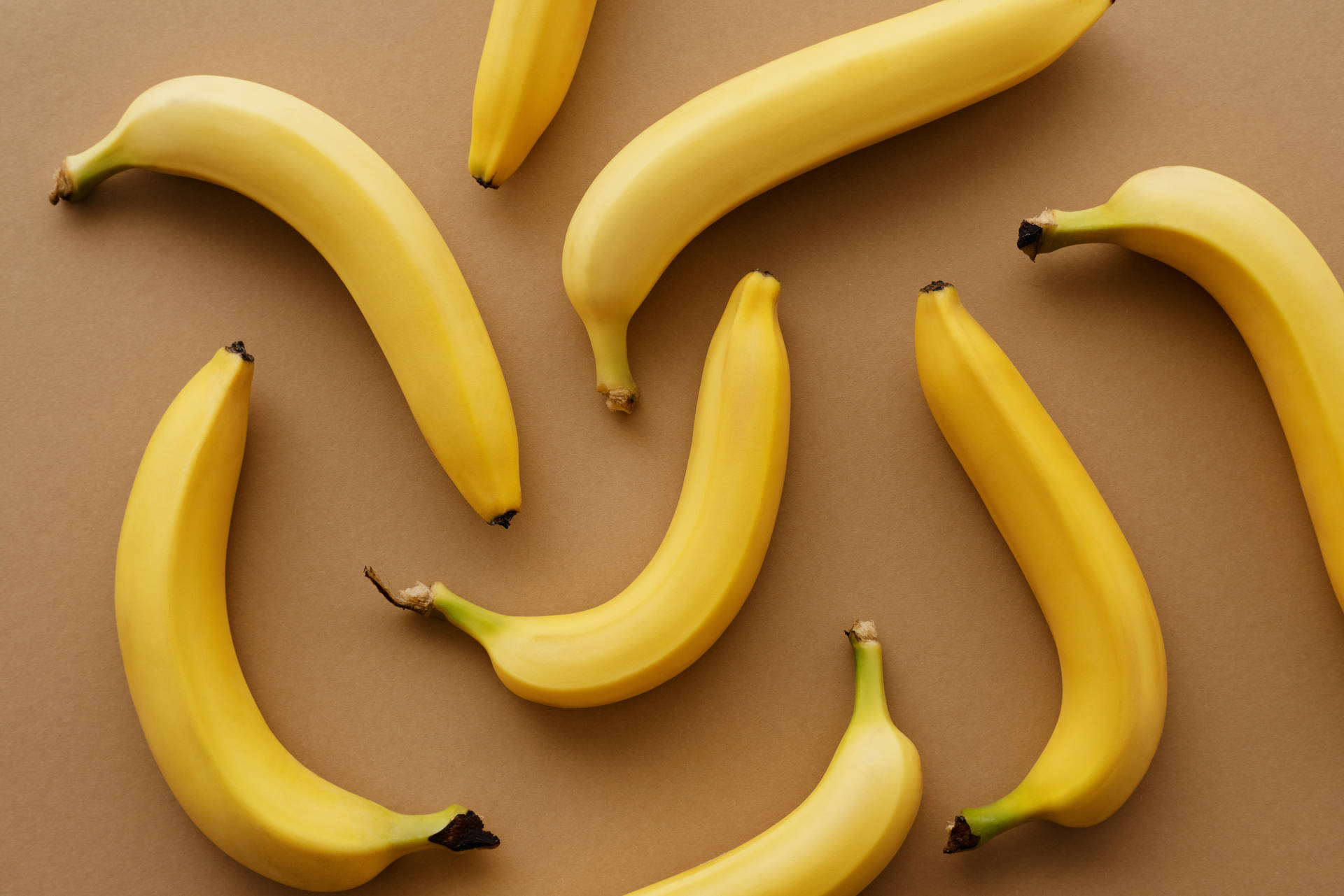 Yellow bananas on a brown background - Banana