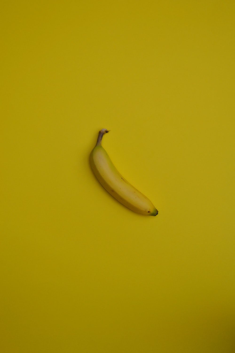 A banana on a yellow background - Banana