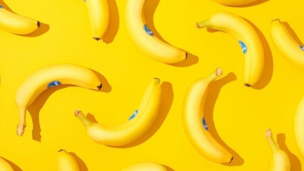 A bunch of bananas on yellow background - Banana