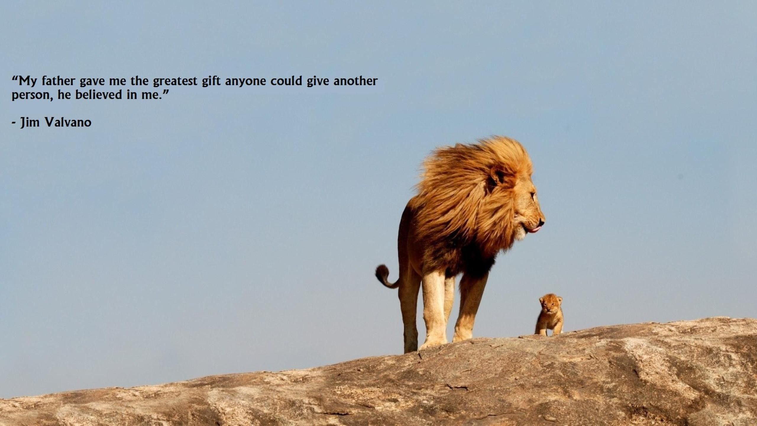 A lion and a cub on a rock with a quote from Jim Valvano. - Lion