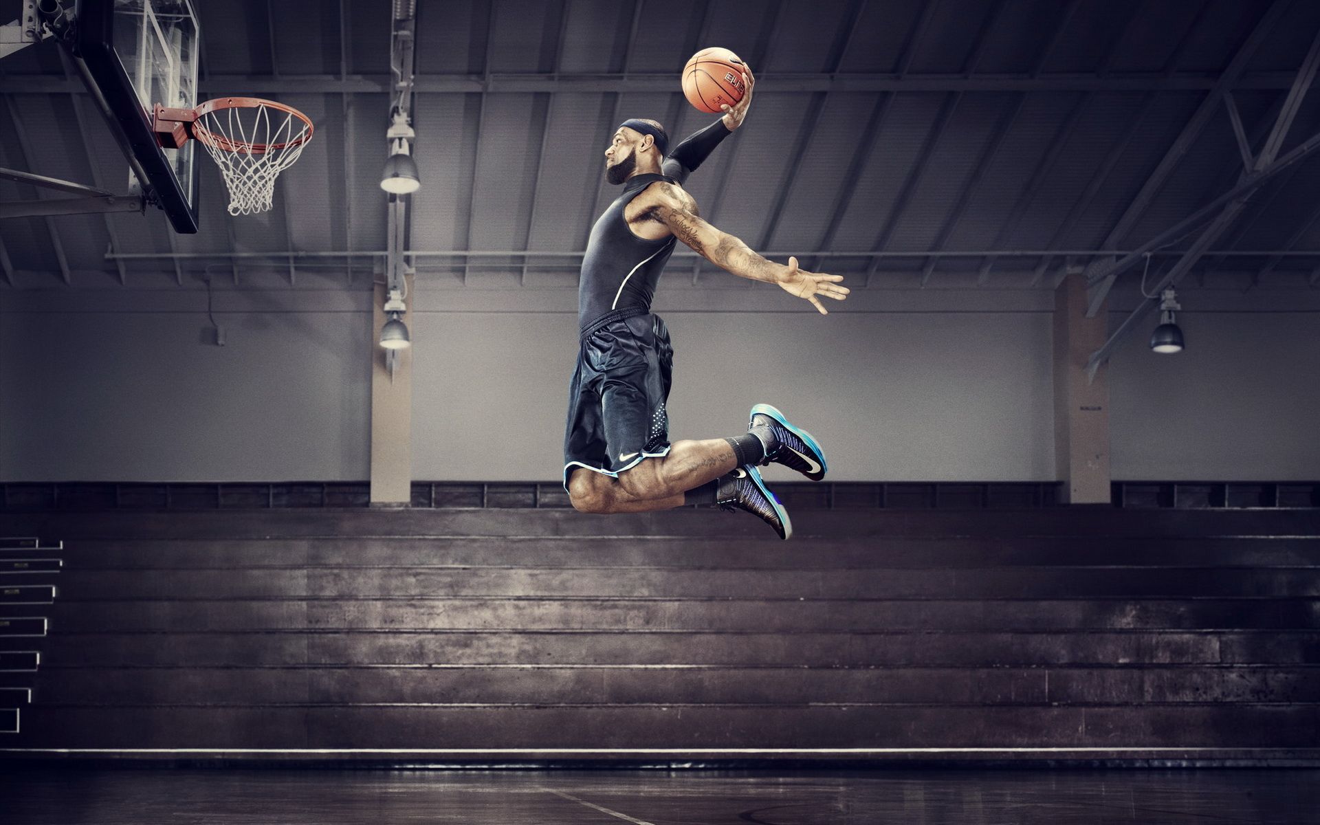 A man jumping up in the air with a basketball in his hand. - Lebron James