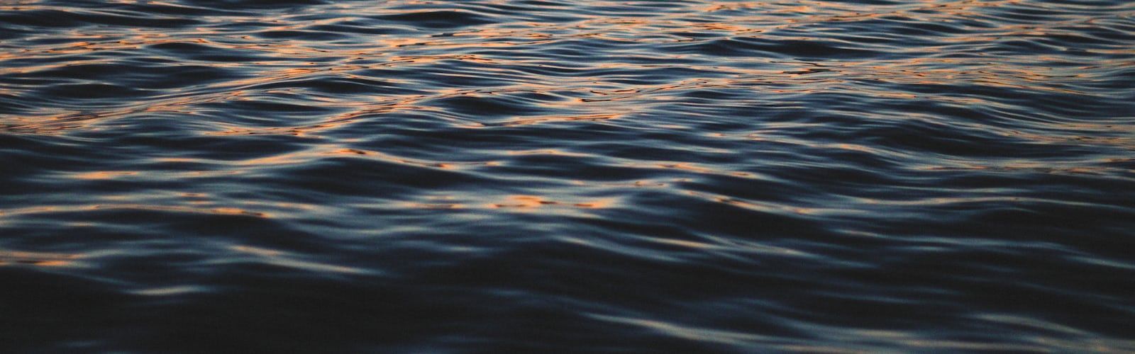 A close up of rippling water at sunset - Lake