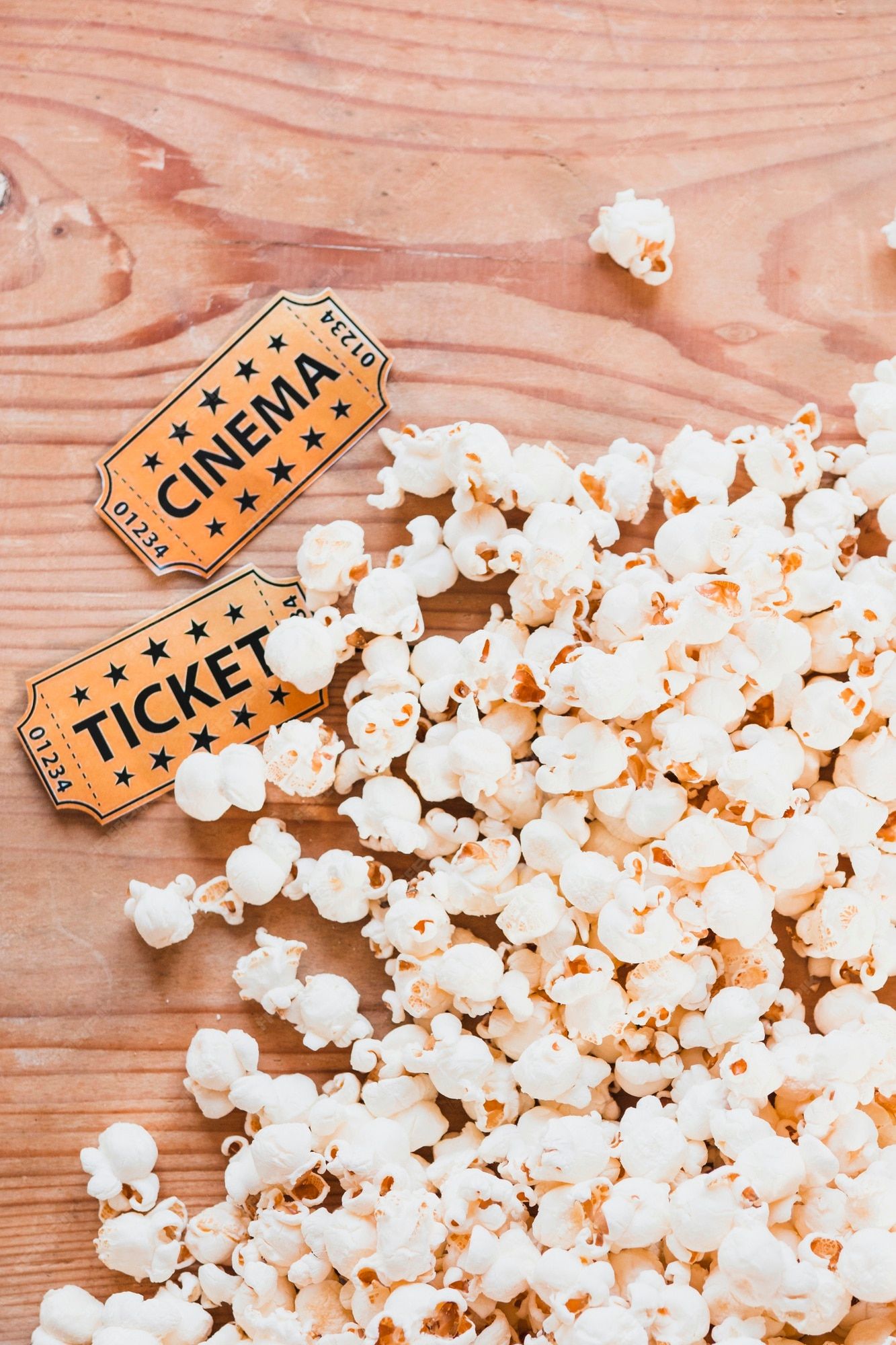 Popcorn and cinema tickets on a wooden table - Popcorn