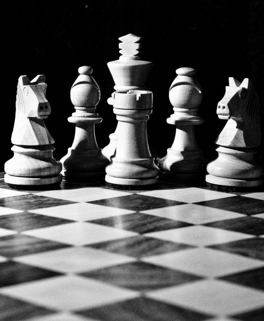 Black and white chess pieces on a chess board - Chess