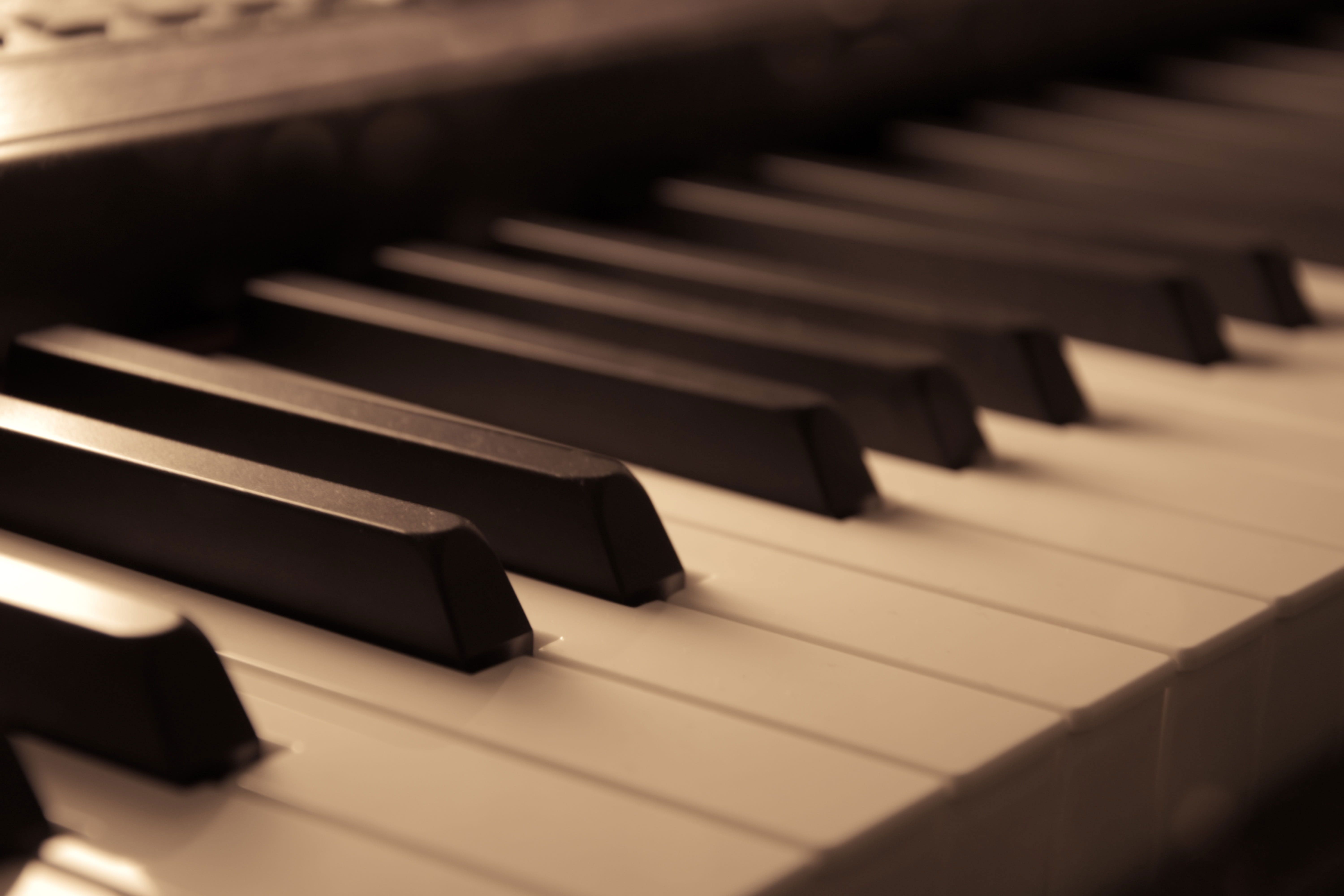 A close up of an old piano - Piano