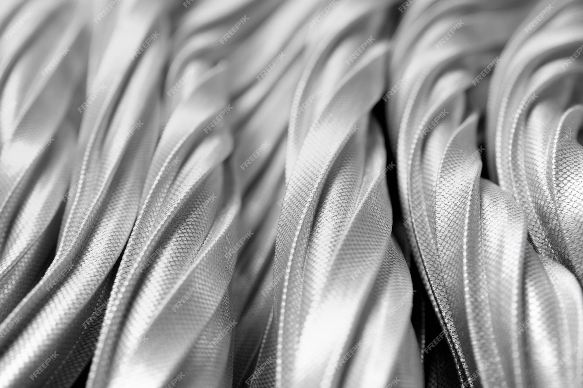 A close up of a silver metal fabric background - Macro