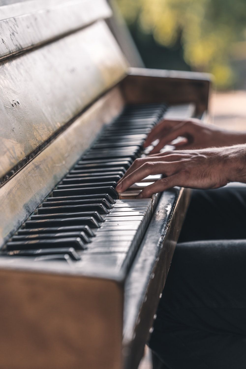 person playing piano during daytime photo