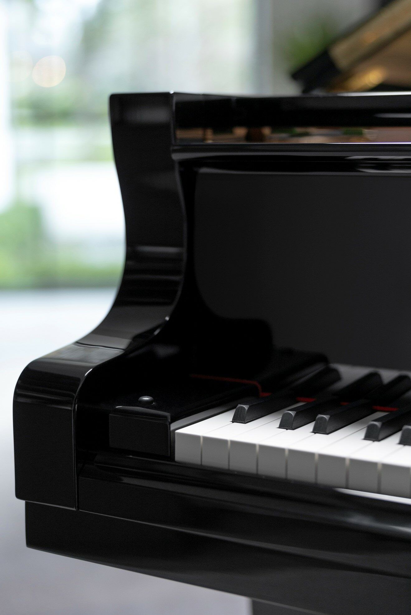 A black piano with keys and pedals - Piano