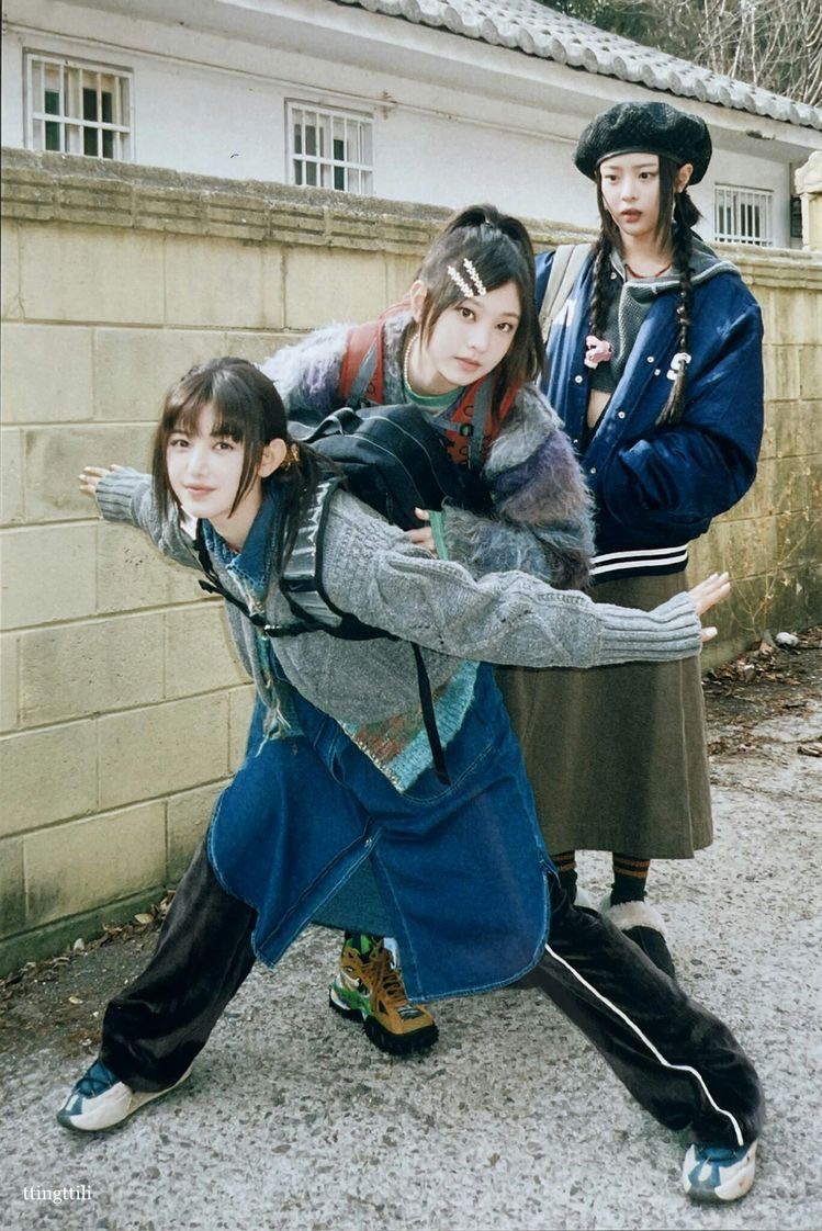 Three women wearing clothes from Nike's new collaboration with Sacai. - NewJeans