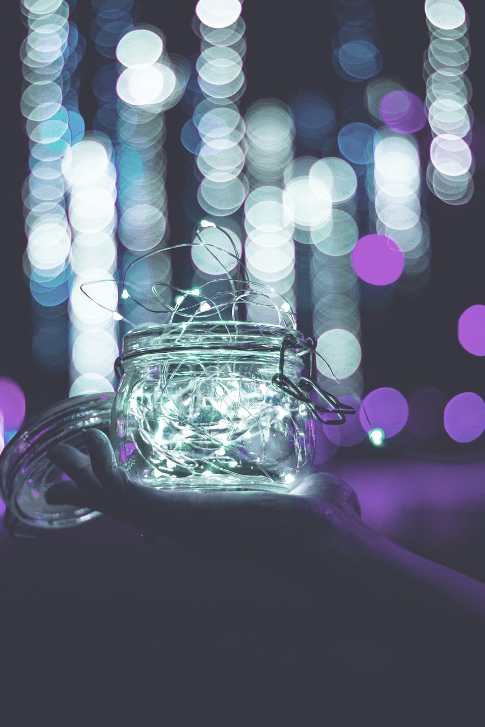 Clear glass jar with string lights photo. - Fairy lights