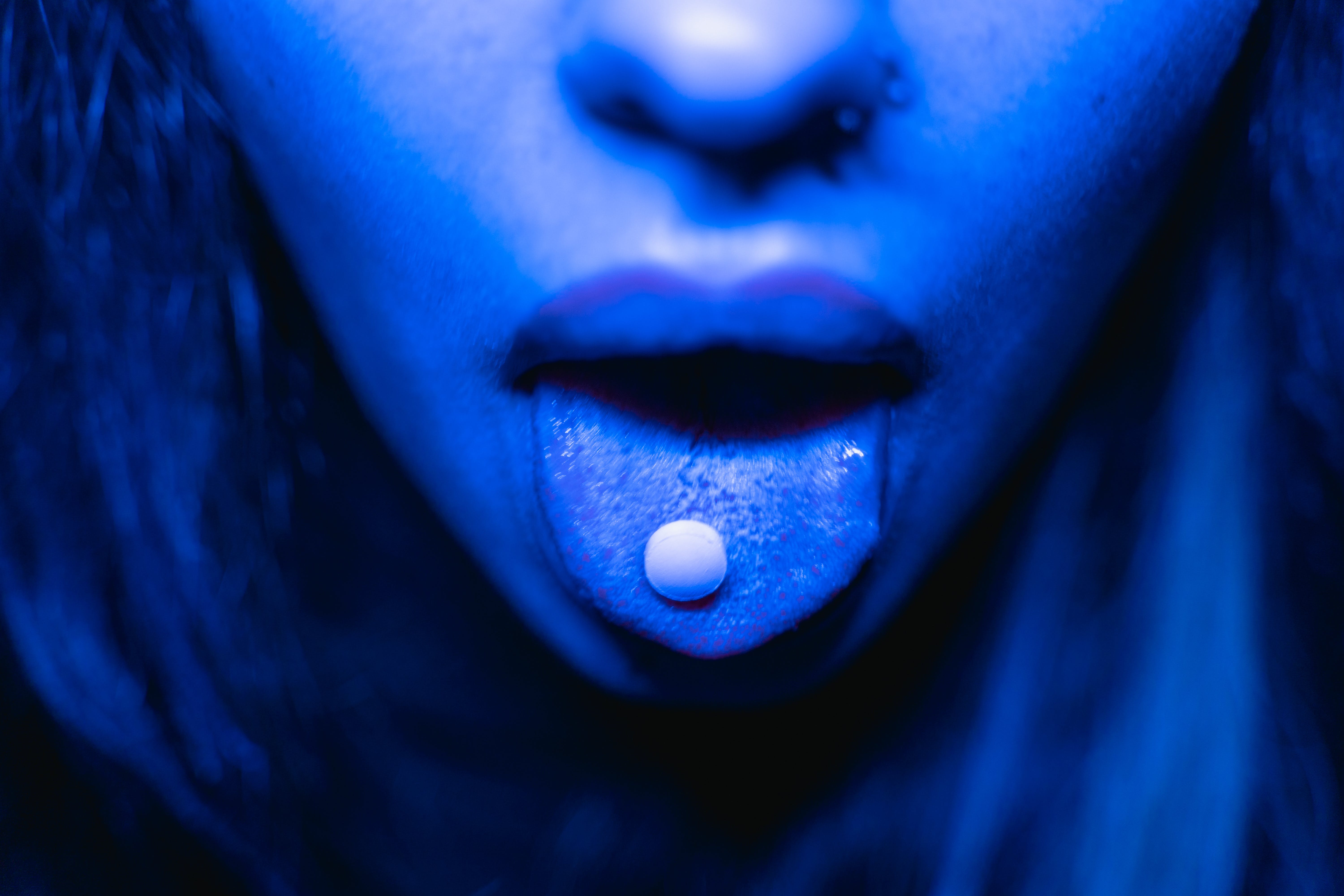 A Drug Tablet on a Person Mouth · Free
