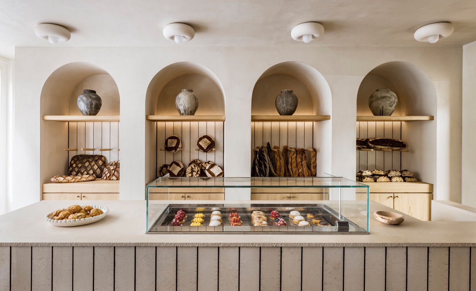 The bakery counter is displayed with a variety of pastries. - Bakery