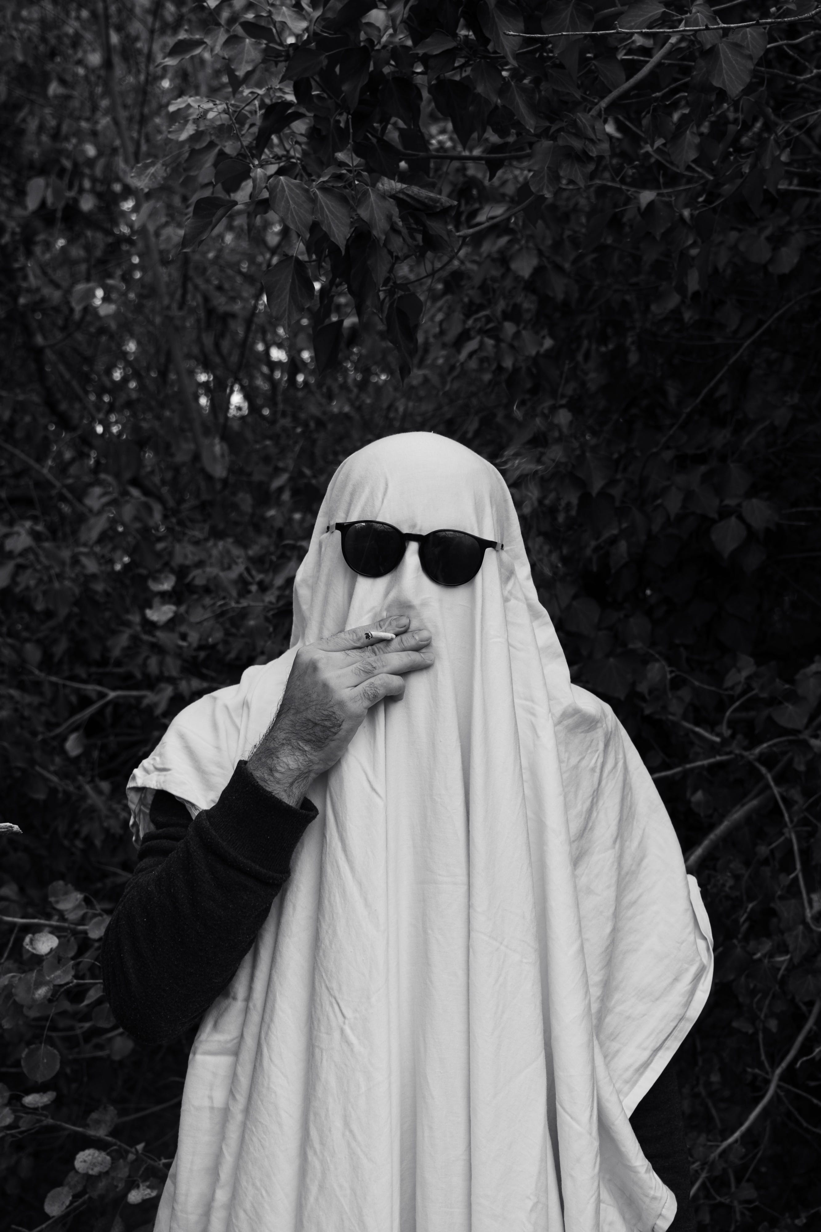 People Covered with White Sheets Dressed as Ghosts in Sunglasses · Free