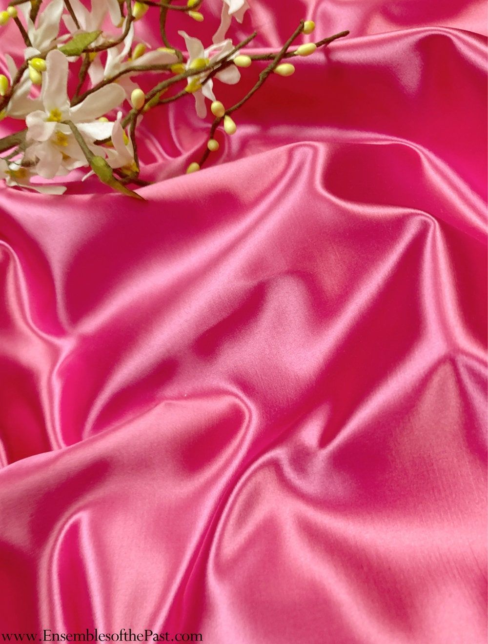 A bright pink silk fabric with a white orchid - Silk