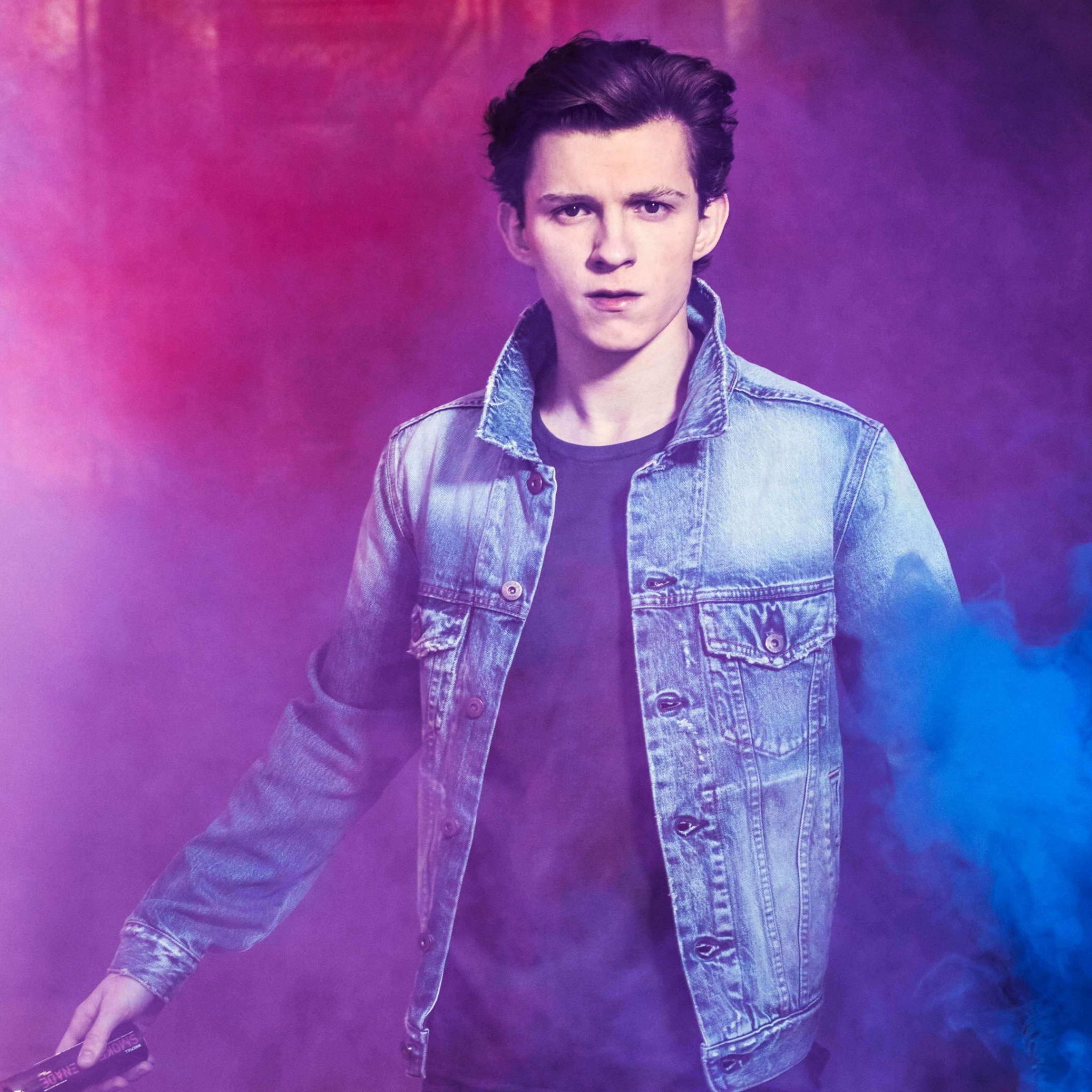 Tom Holland standing in a cloud of purple and blue smoke - Tom Holland