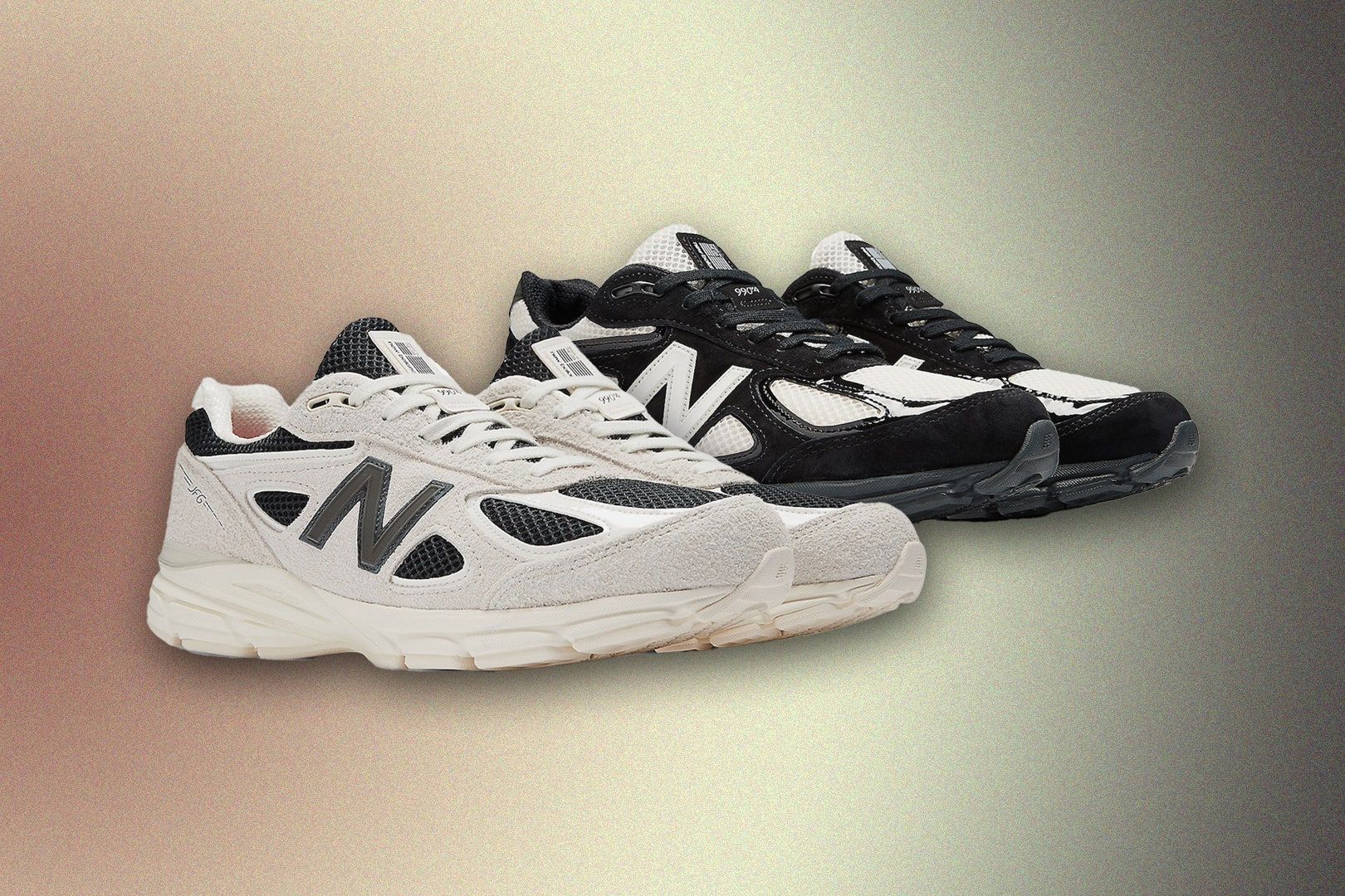 A pair of black and white New Balance 990v4 sneakers on a tan gradient background - New Balance