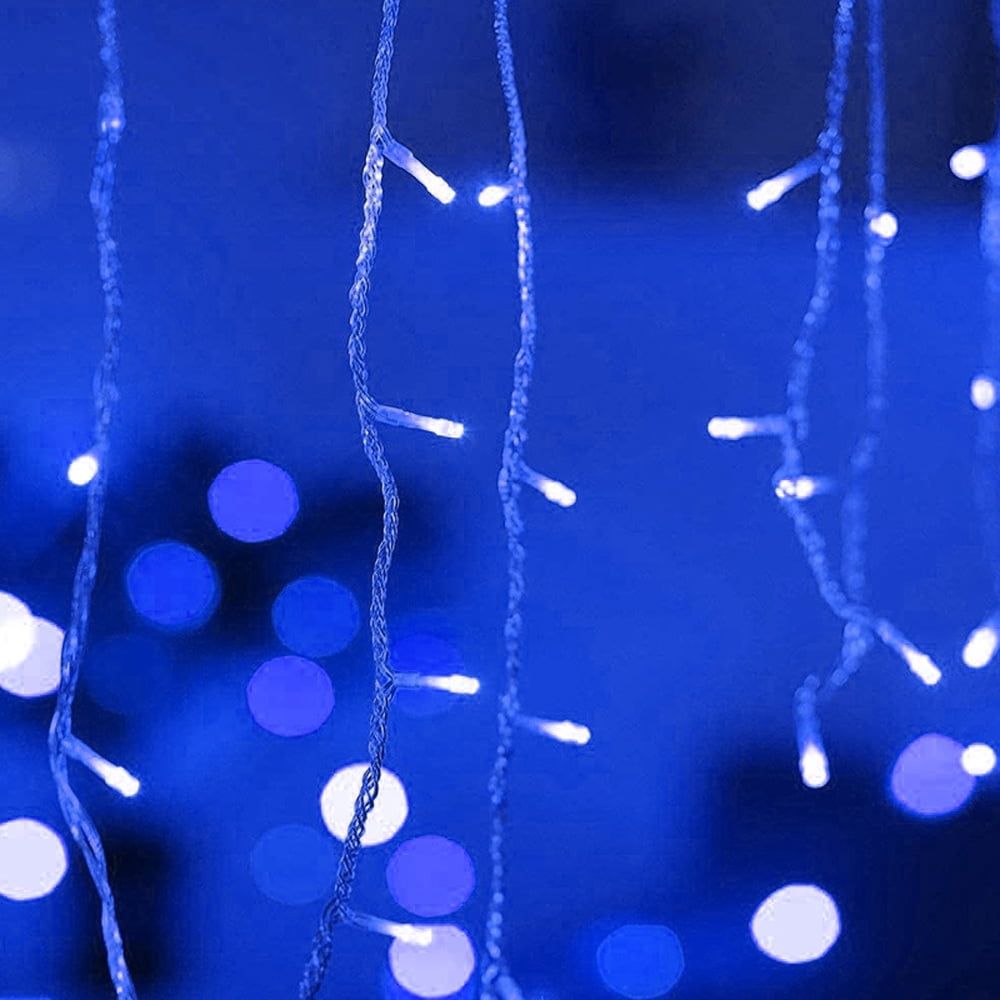 A string of blue lights against a blue background. - Fairy lights