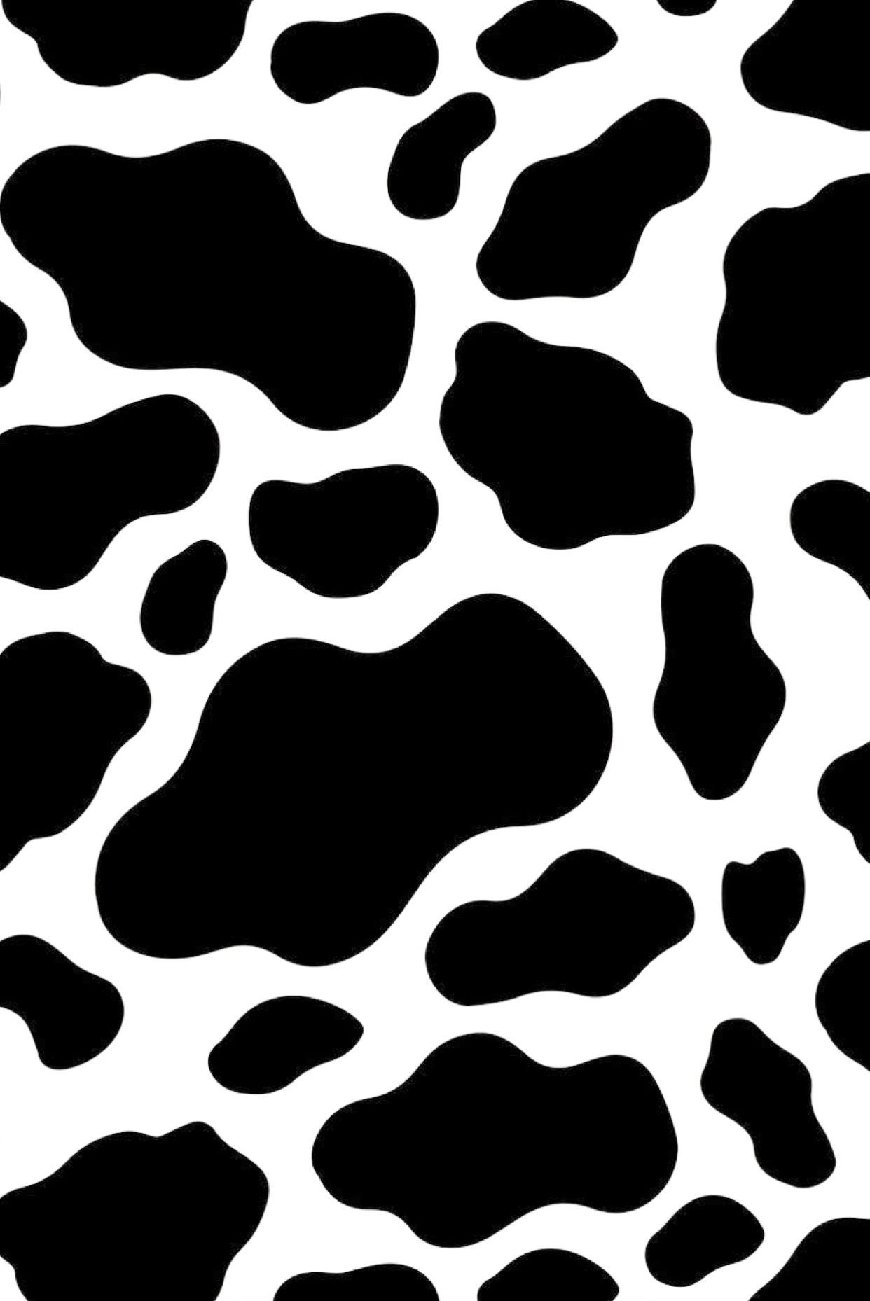 This is a photo of a cow print wallpaper in black and white. - Cow