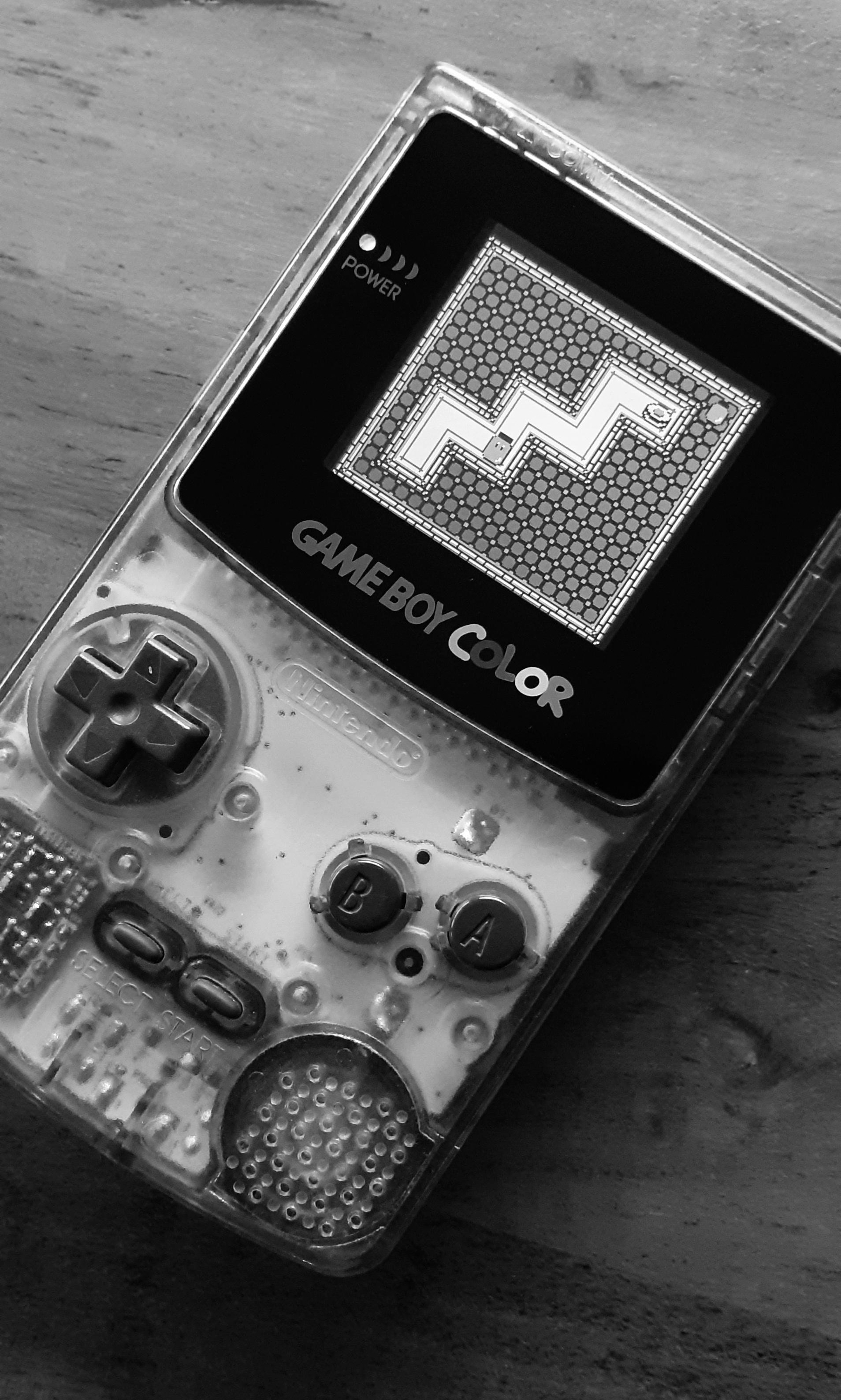A Nintendo Gameboy Color in black and white. - Game Boy