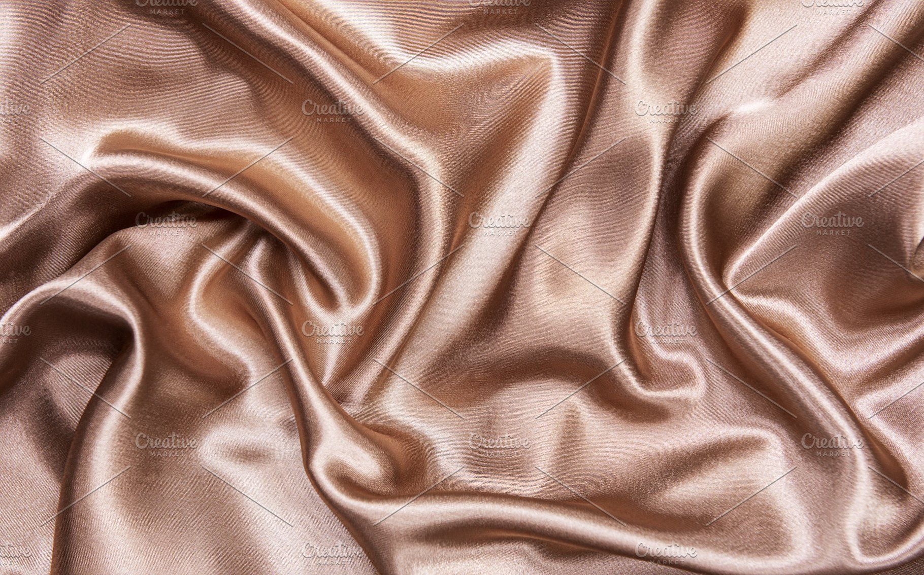 Brown silk background containing beige