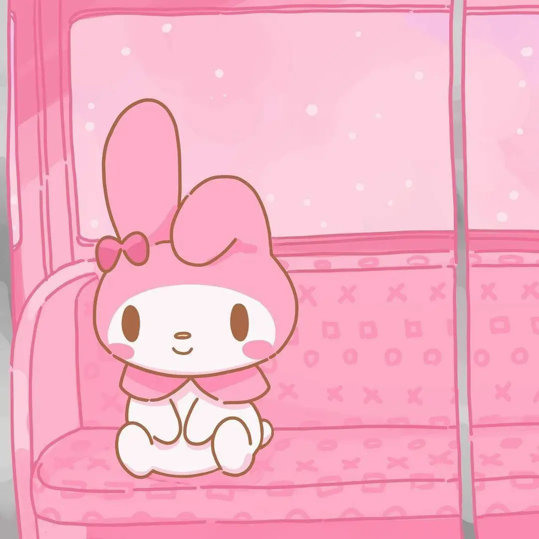 A pink cartoon image of a cat sitting on a pink couch. - My Melody