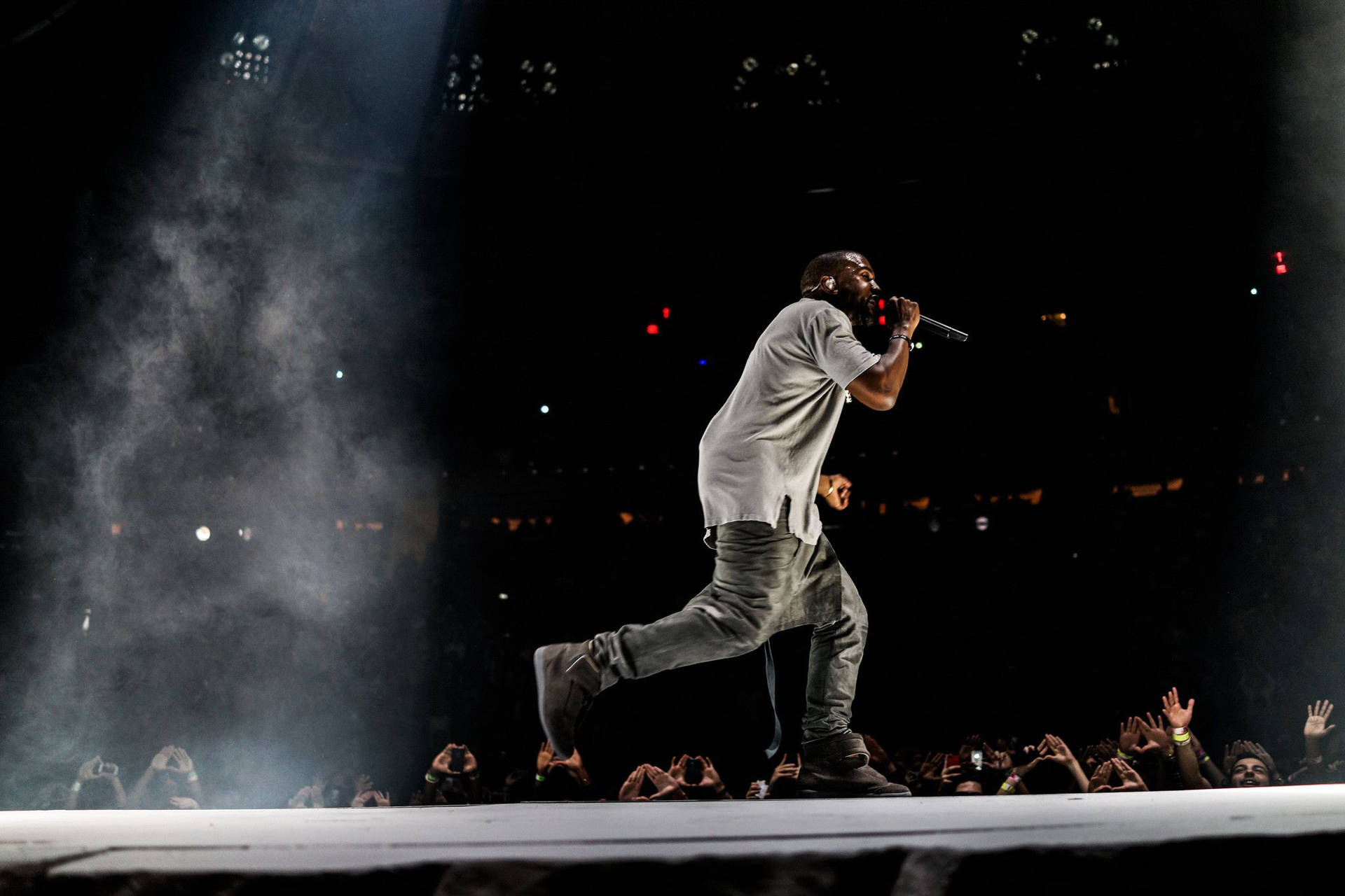 Download Kanye West Pacing On Stage Wallpaper