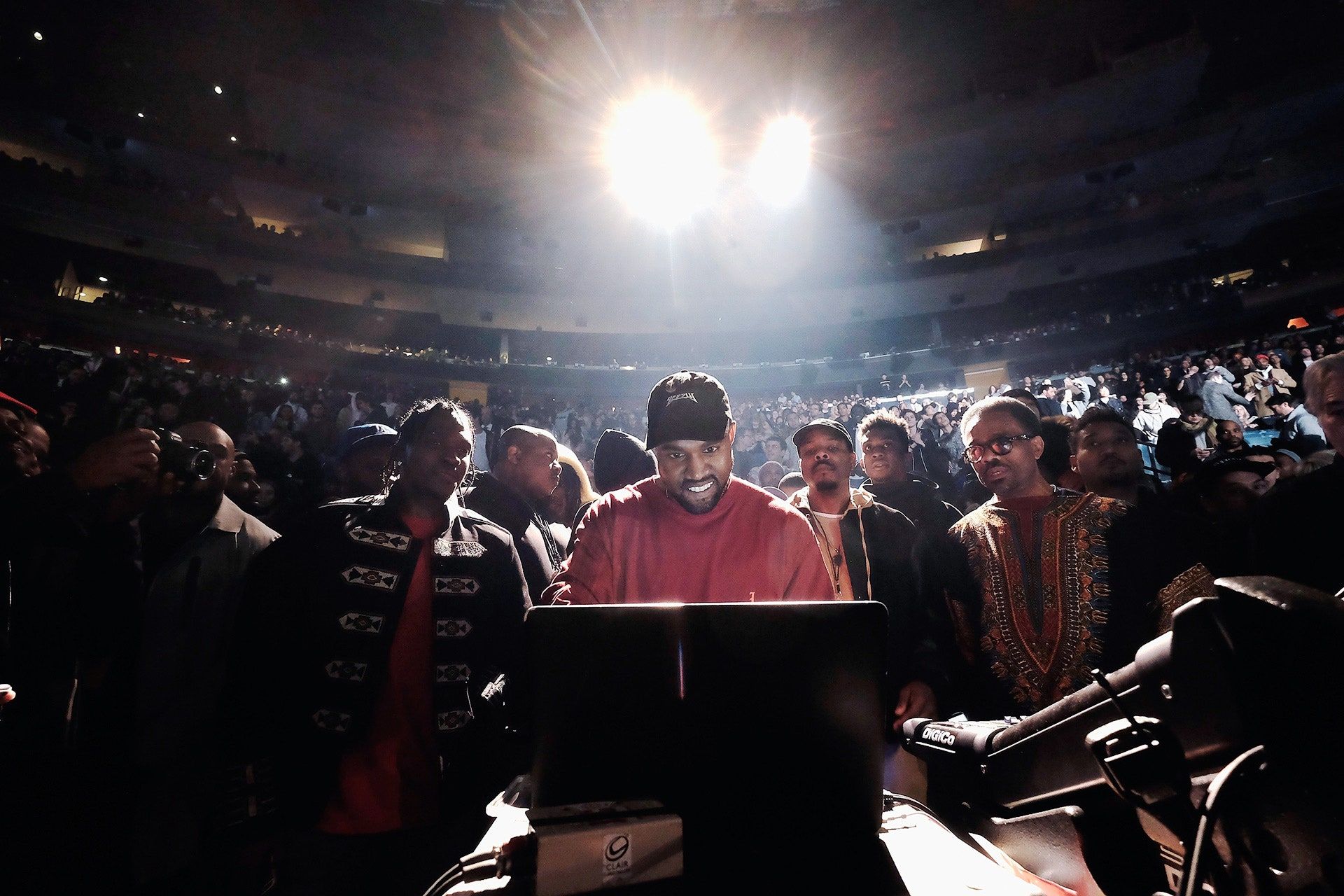 A man standing in front of an audience - Kanye West