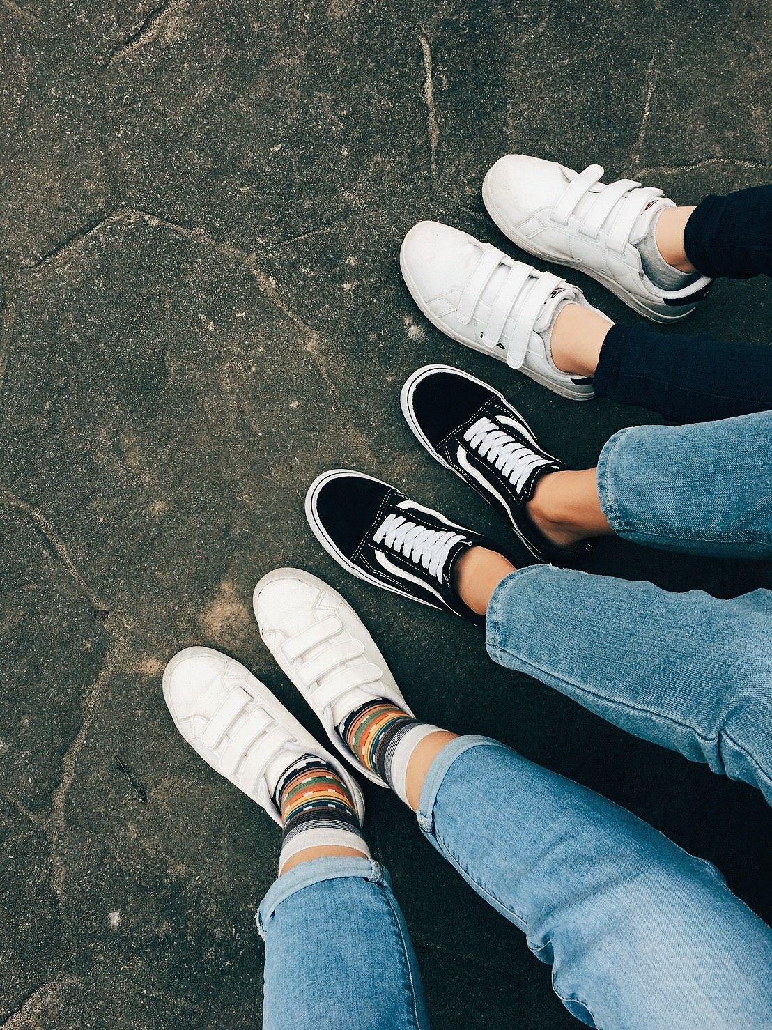 A group of people standing on top each other - Vans