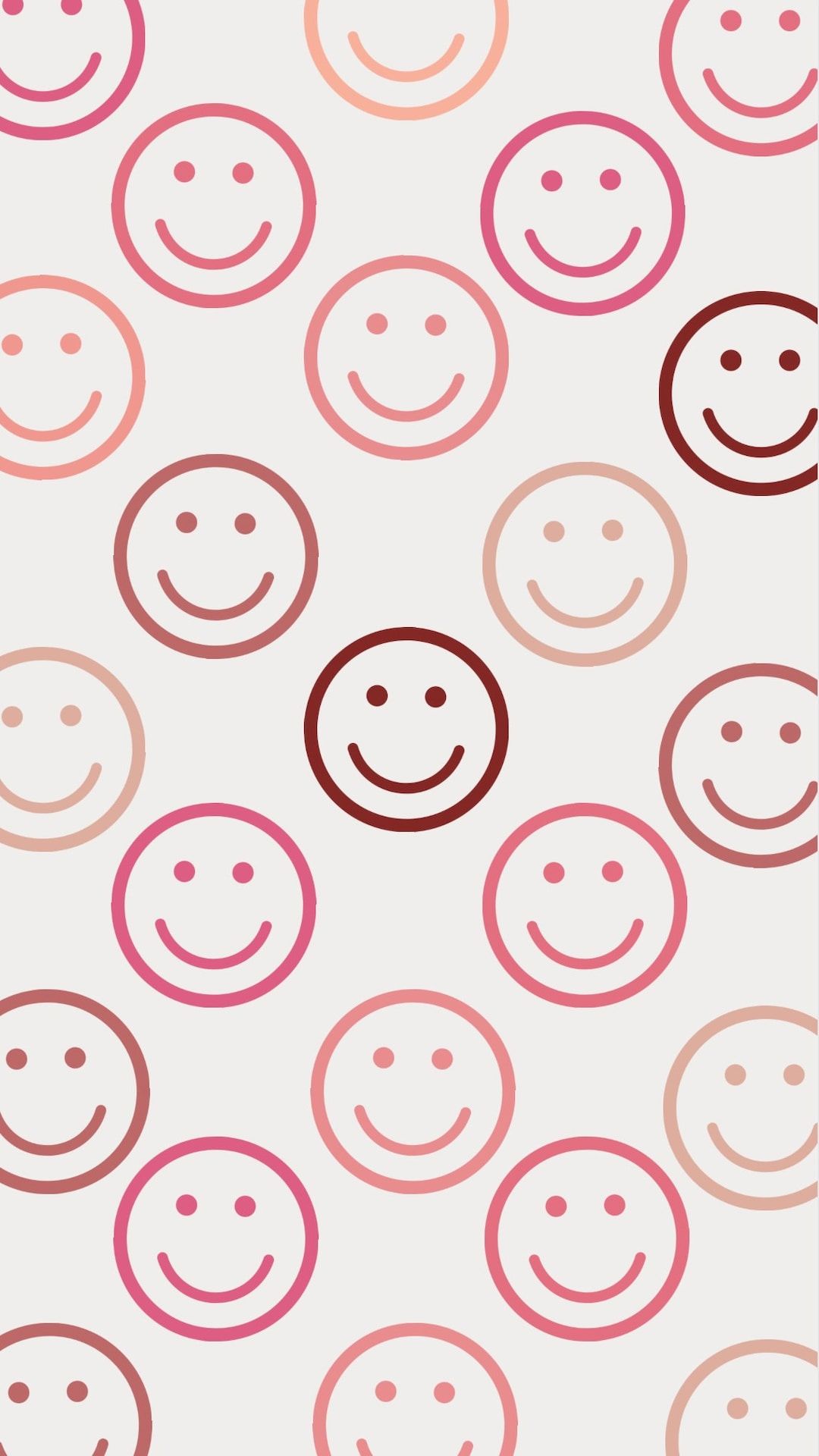 IPhone wallpaper with a pattern of smiling faces in pink and red hues - Smiley