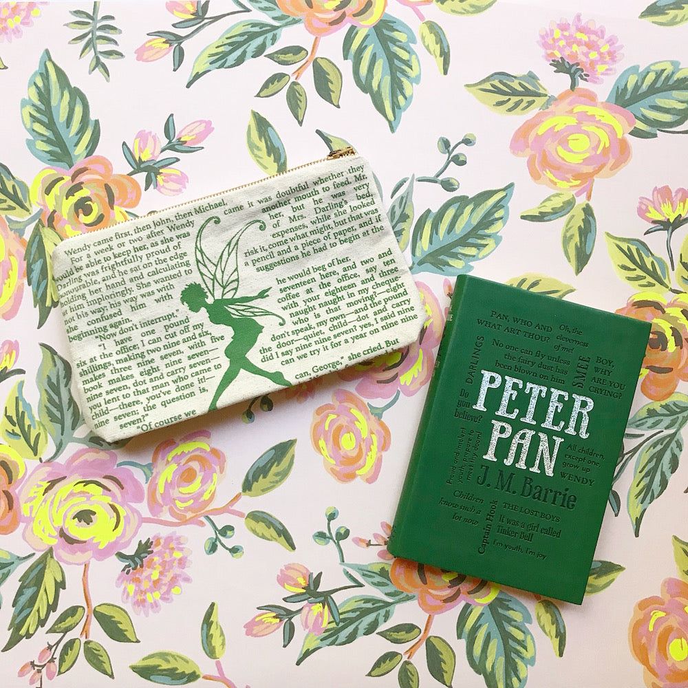 Peter Pan book and wallet on a floral background - Peter Pan