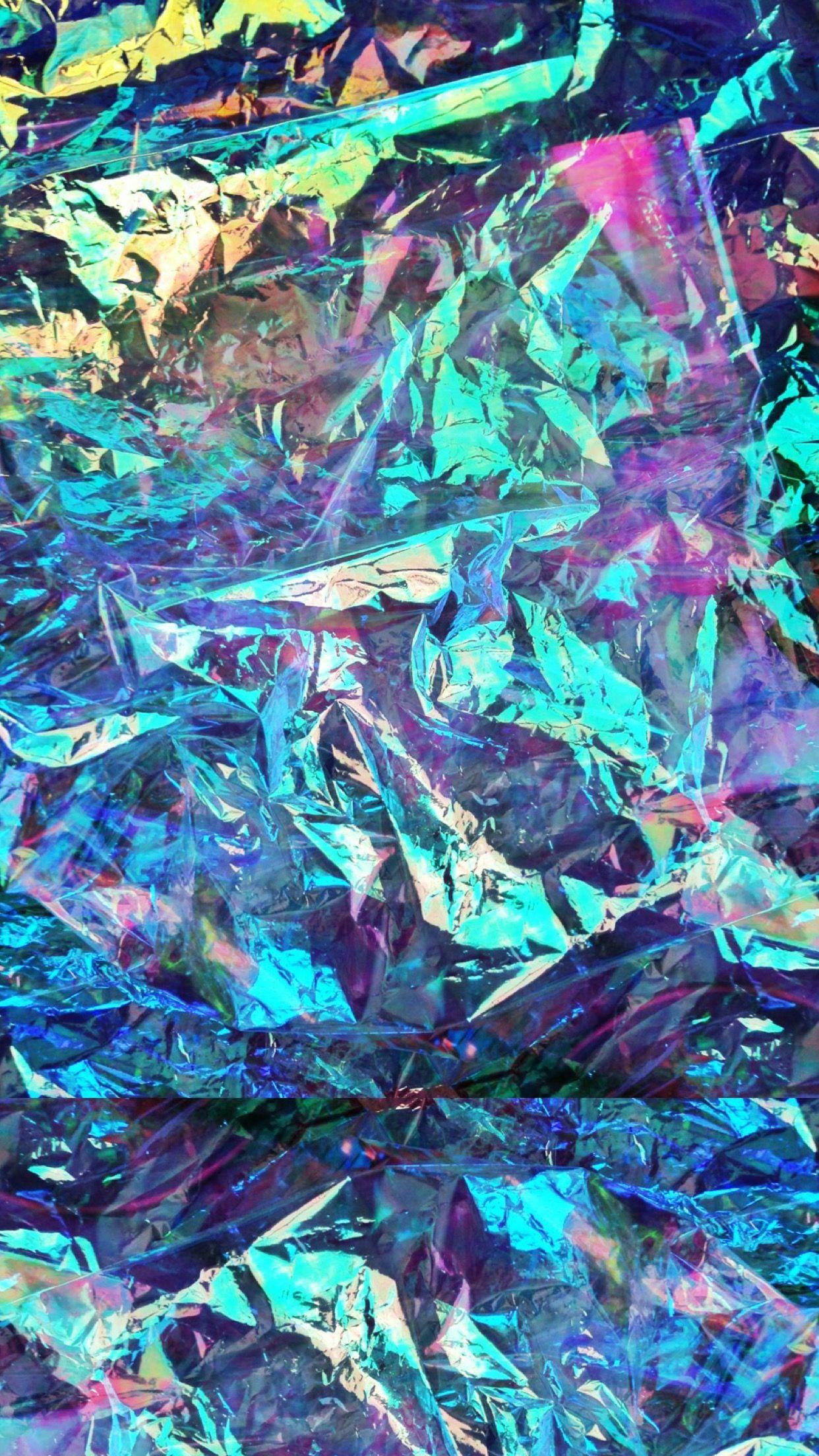 A colorful abstract piece of art with blue, purple, and green hues. - Holographic