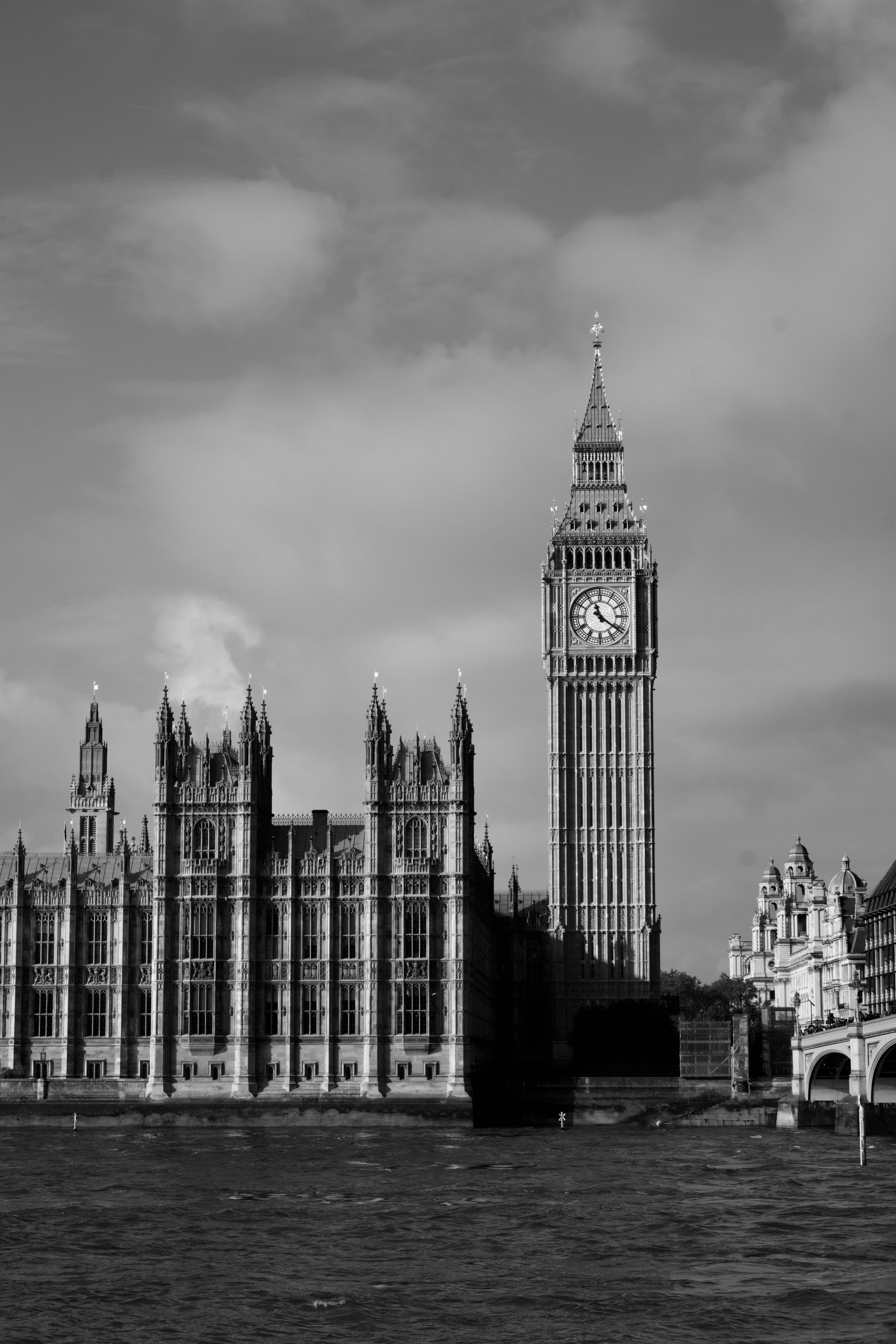 A black and white photo of the big ben clock tower in London. - London