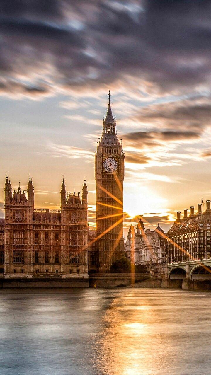 The sun is setting behind the clock tower. - London