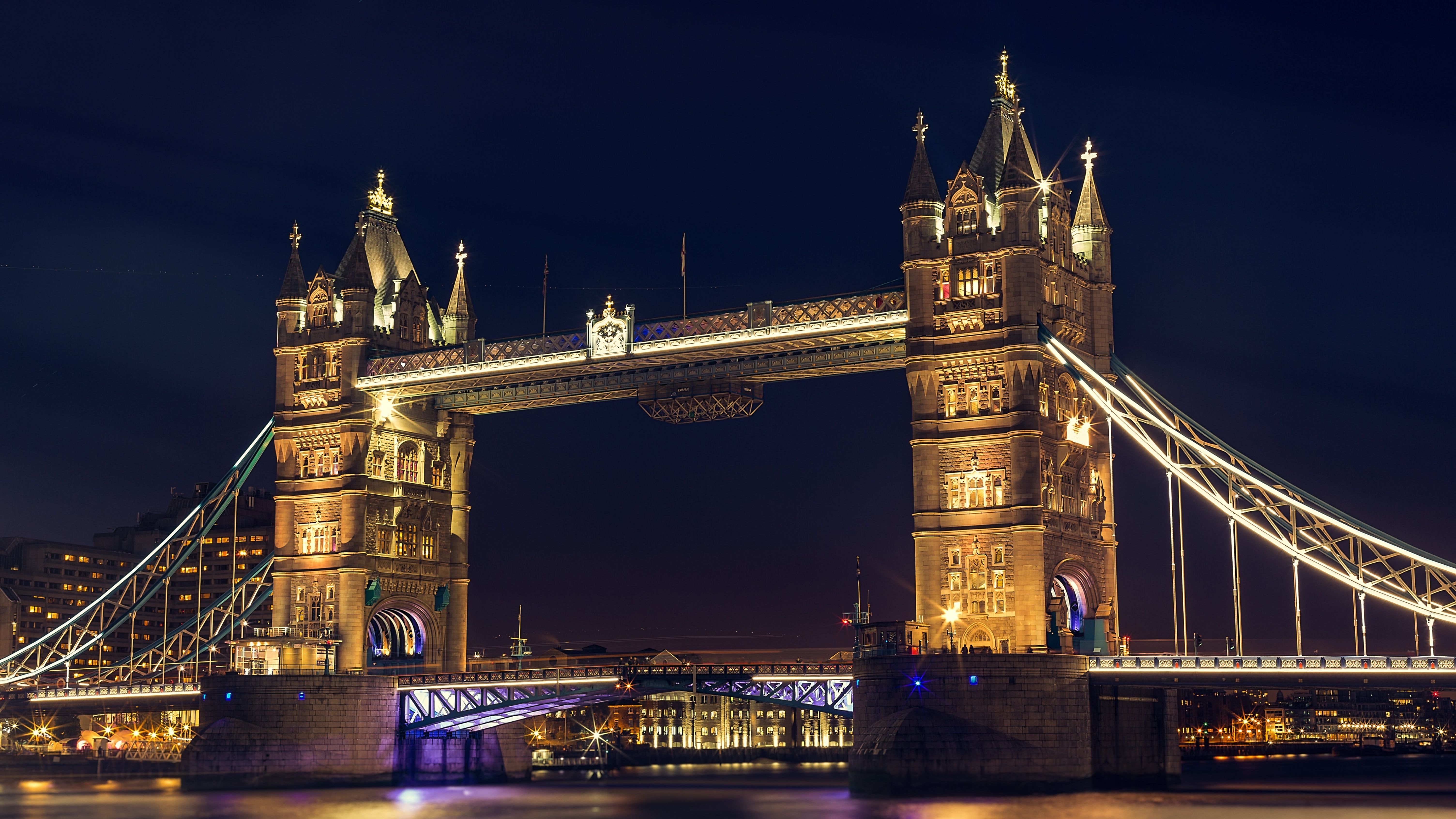 The Tower Bridge in London at night. - London