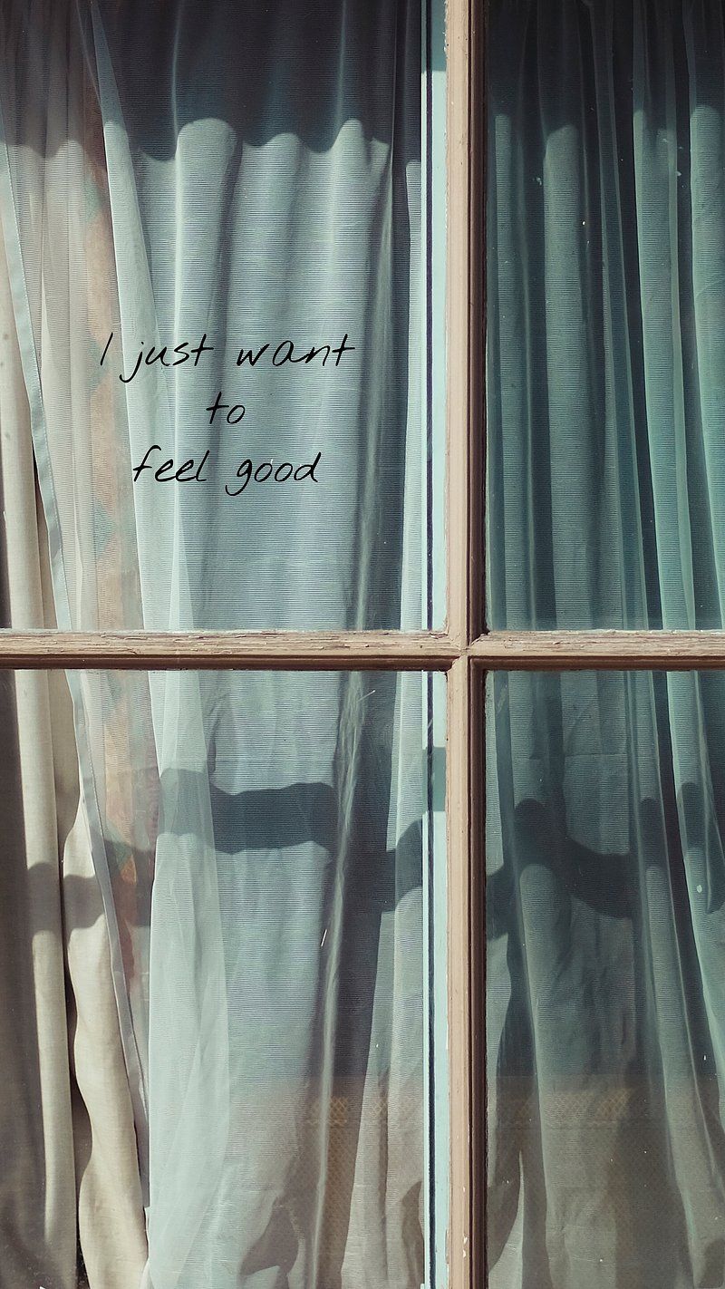 A window with a curtain and the words 